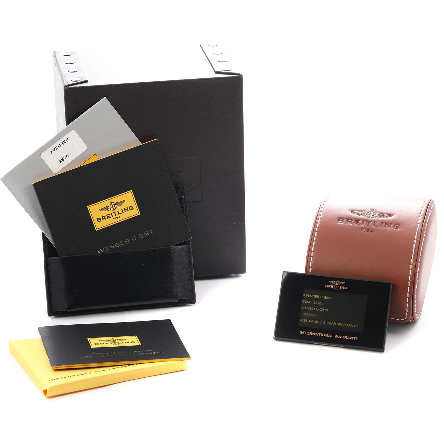 The image shows Breitling Avenger A32390 Men
s Stainless Steel Mother of Pearl Dial watch accessories including a box, documents, a leather case, and a warranty card.