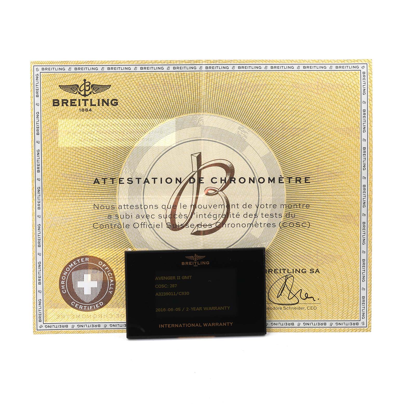 The image shows a warranty card and chronometer certificate for a Breitling Avenger A32390 Men
s Stainless Steel Mother of Pearl Dial watch.