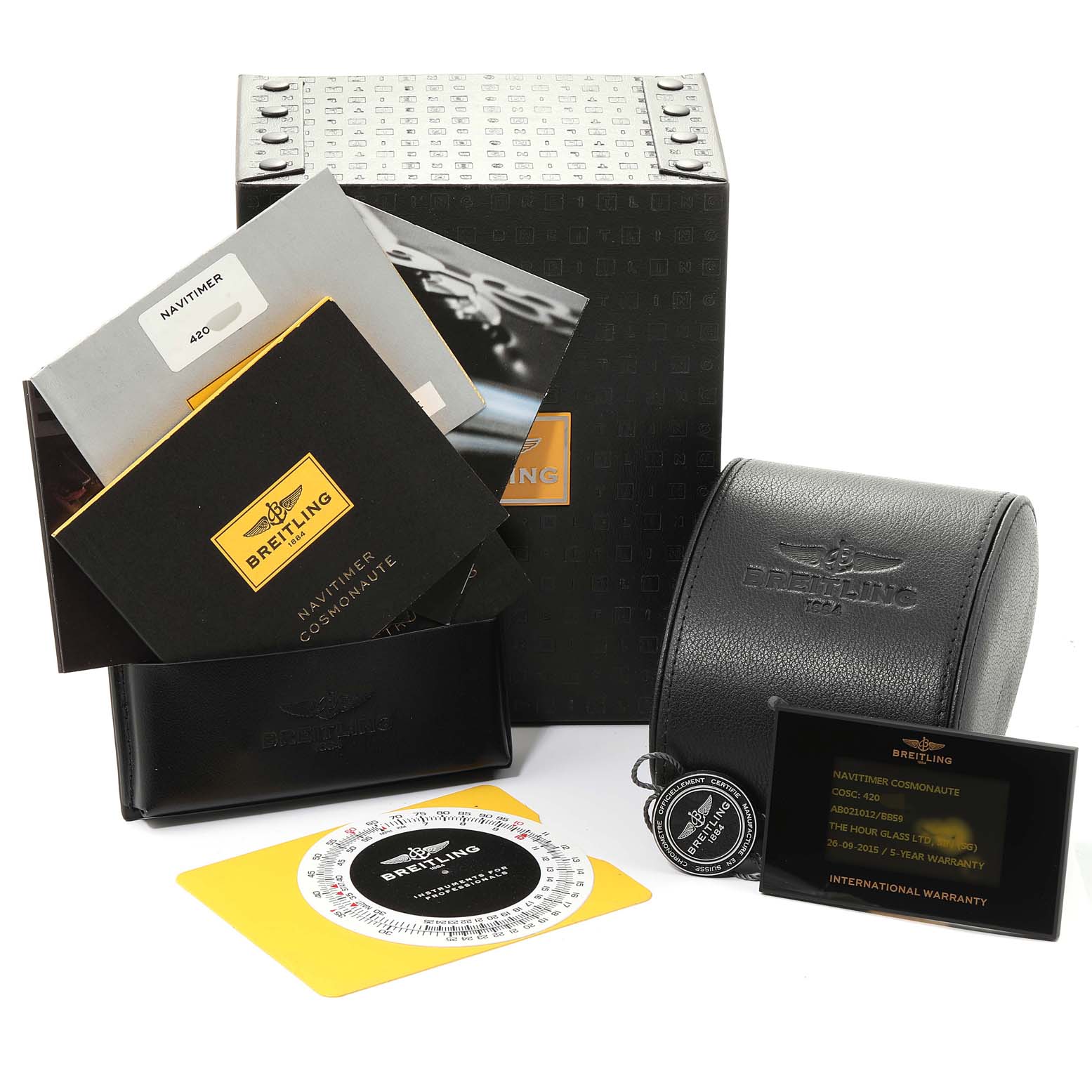 The image shows the packaging and accessories for a Breitling Navitimer AB0210 Men's Stainless Steel Black Dial AB0210 Men's Stainless Steel Black Dial model, including manuals, a warranty card, a case, and a slide rule.