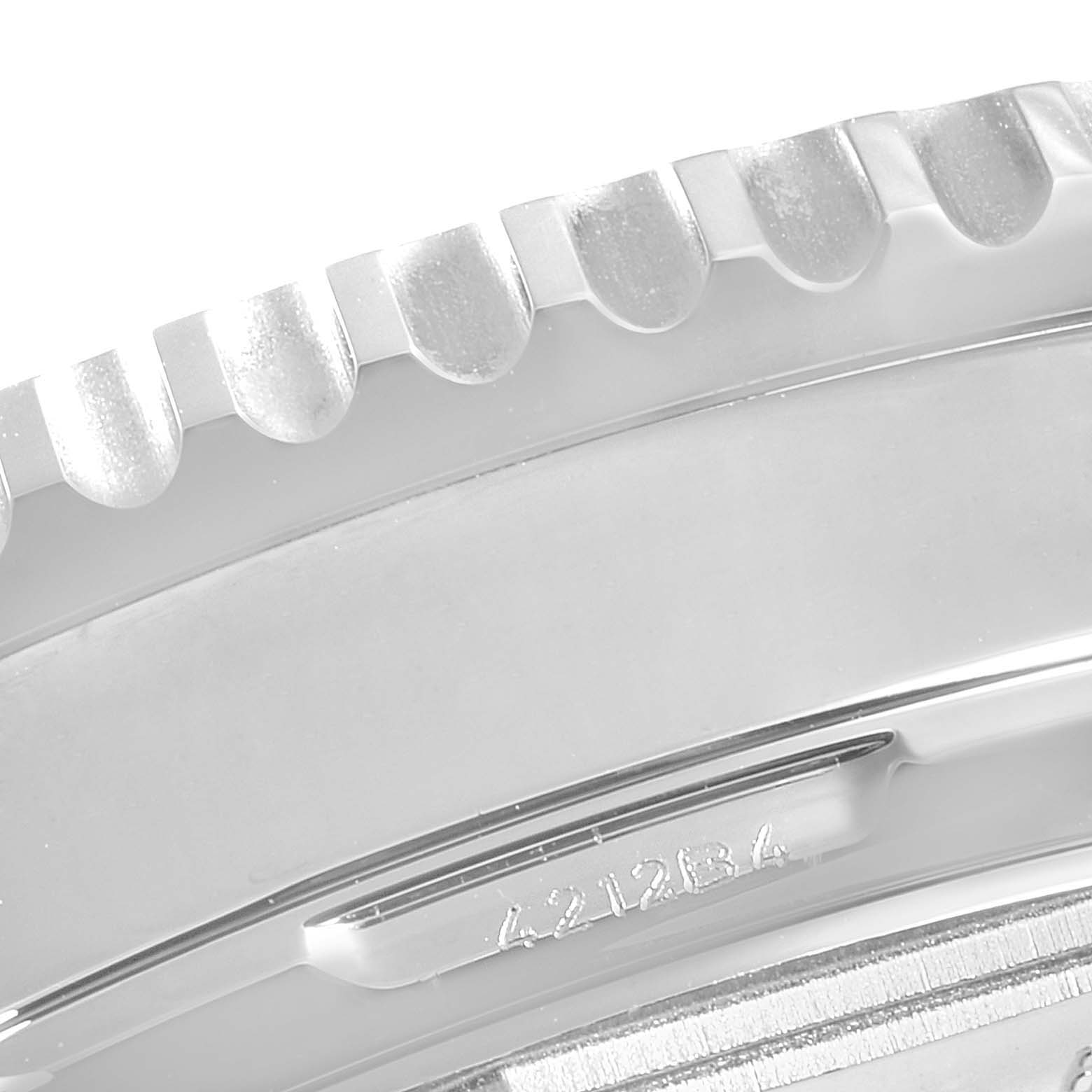 This close-up image shows a portion of the bezel and the case of the Breitling Navitimer AB0210 Men's Stainless Steel Black Dial AB0210 Men's Stainless Steel Black Dial watch.