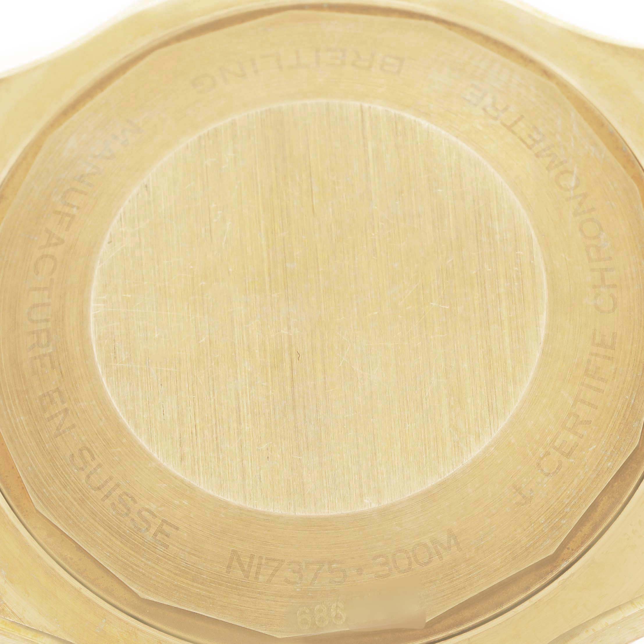 The image shows the backside of a Breitling Superocean N17375 Men
s Bronze Green Dial watch, highlighting its engraved case back details.