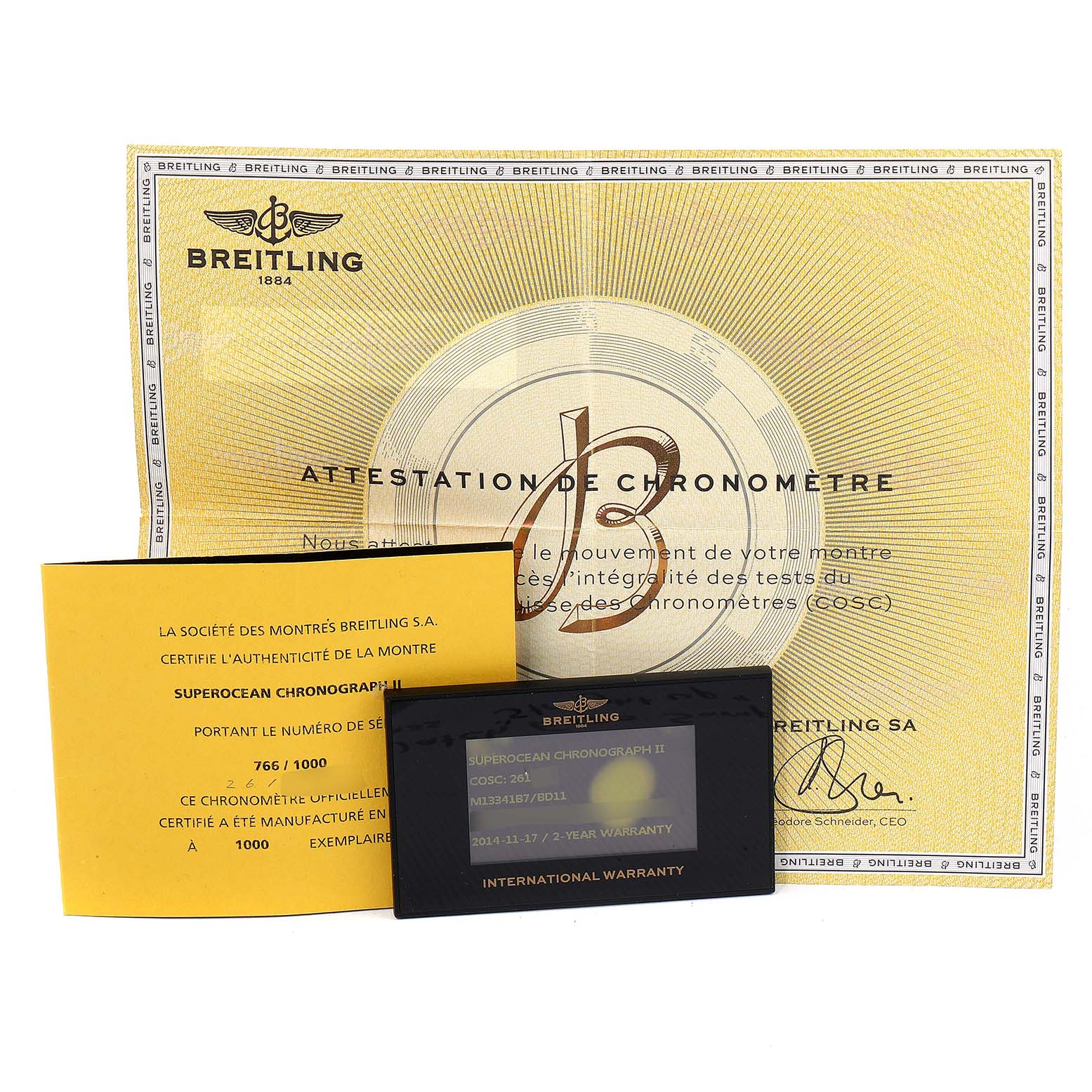 The image shows documentation for the Breitling Superocean M13341 Men's Stainless Steel Black Dial M13341 Men's Stainless Steel Black Dial model, including a chronometer certificate, an authenticity card, and an international warranty card.