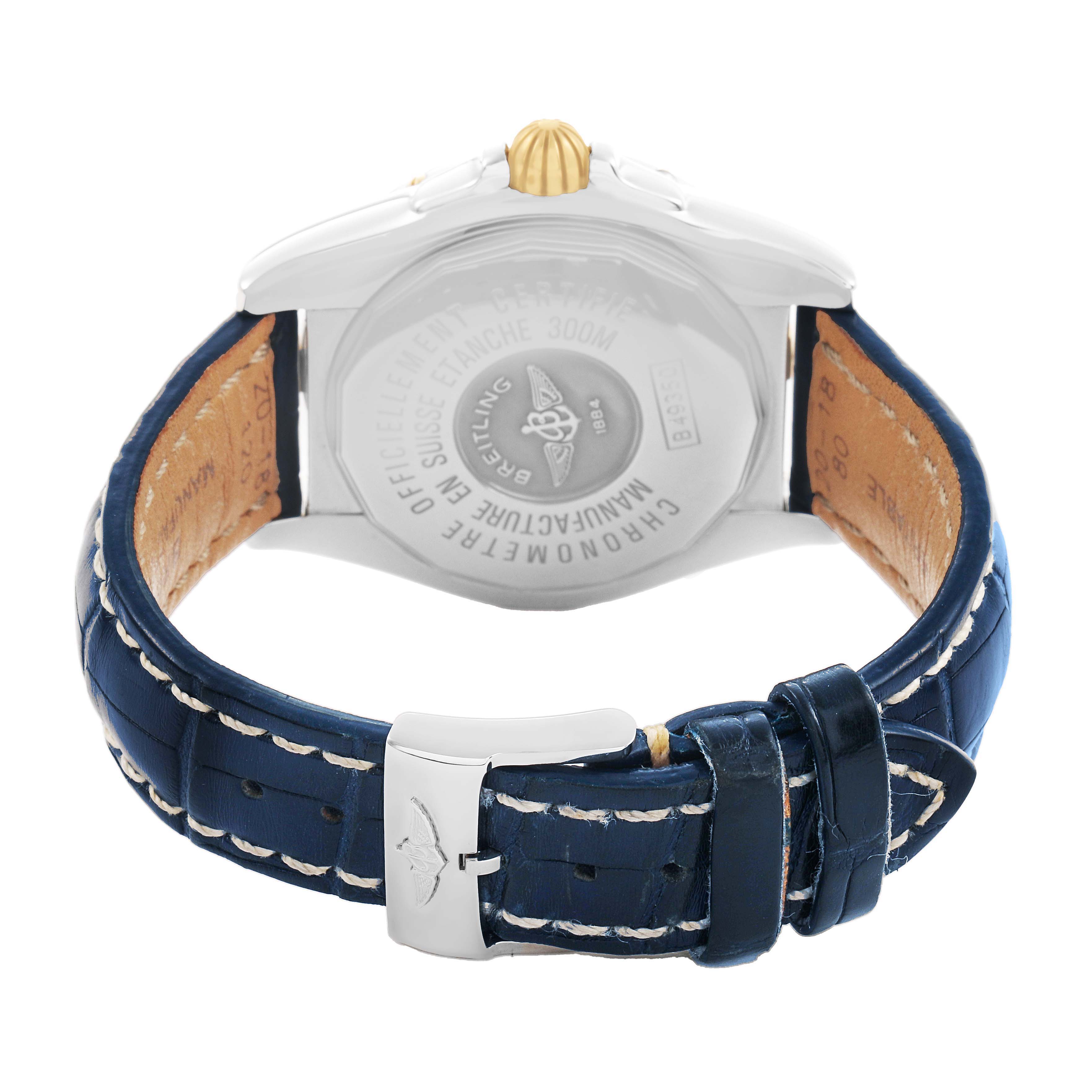 The image shows the back of a Breitling Windrider B49350 Men's Steel and Gold (two tone) Mother of Pearl Dial watch, featuring the case back, crown, and blue leather strap with white stitching.