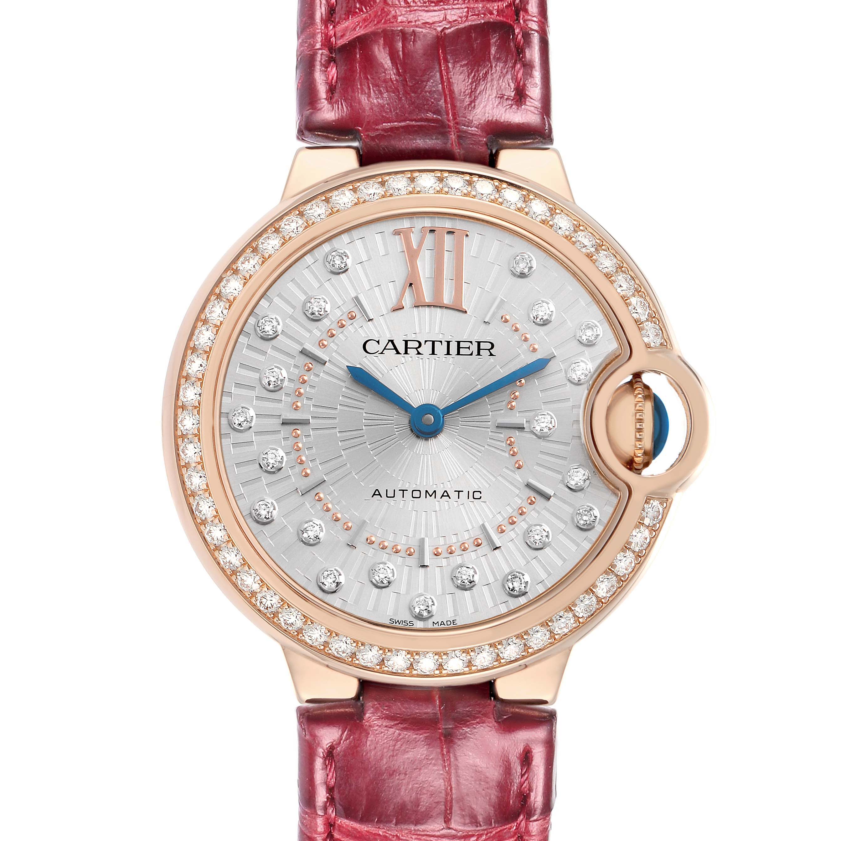 The Cartier Ballon Bleu WJBB0080 Women
s Rose Gold Silver Dial watch is shown from the front, highlighting its diamond-adorned bezel and silver dial, with a red strap.