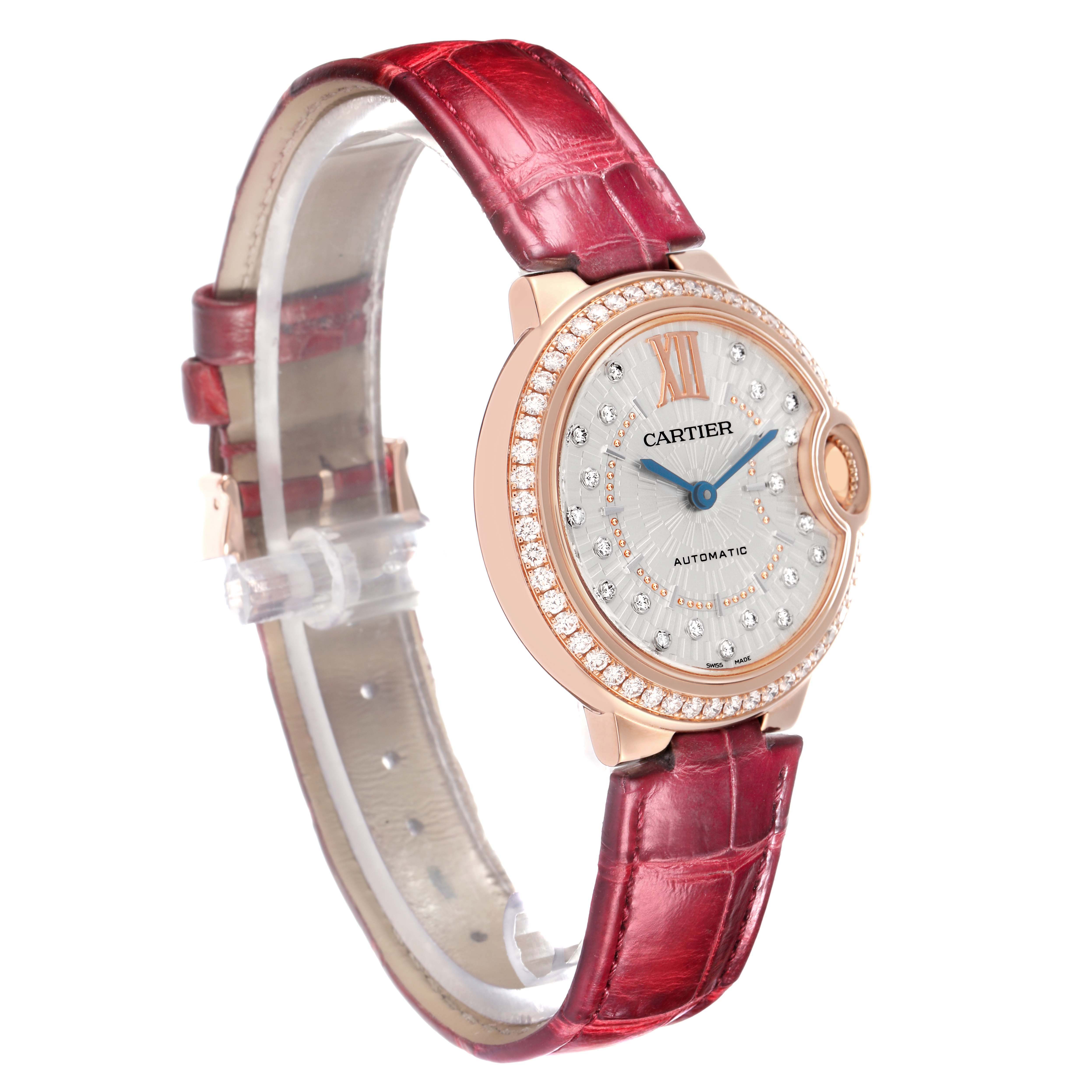The Cartier Ballon Bleu WJBB0080 Women
s Rose Gold Silver Dial watch is shown at a side angle, displaying the watch face, case, and red leather strap.