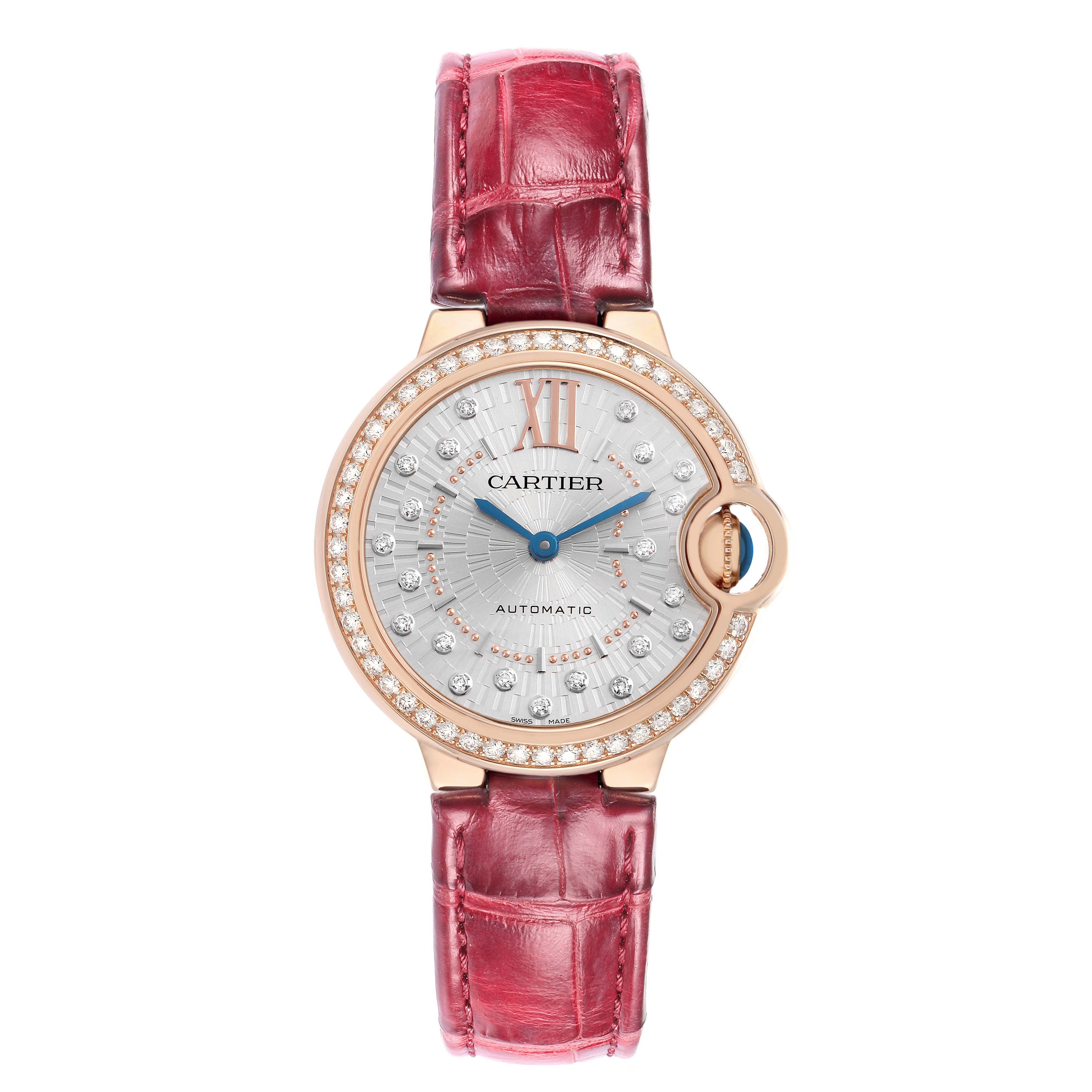 The Cartier Ballon Bleu WJBB0080 Women
s Rose Gold Silver Dial watch is shown from a front-on angle, highlighting its dial, bejeweled bezel, and red strap.