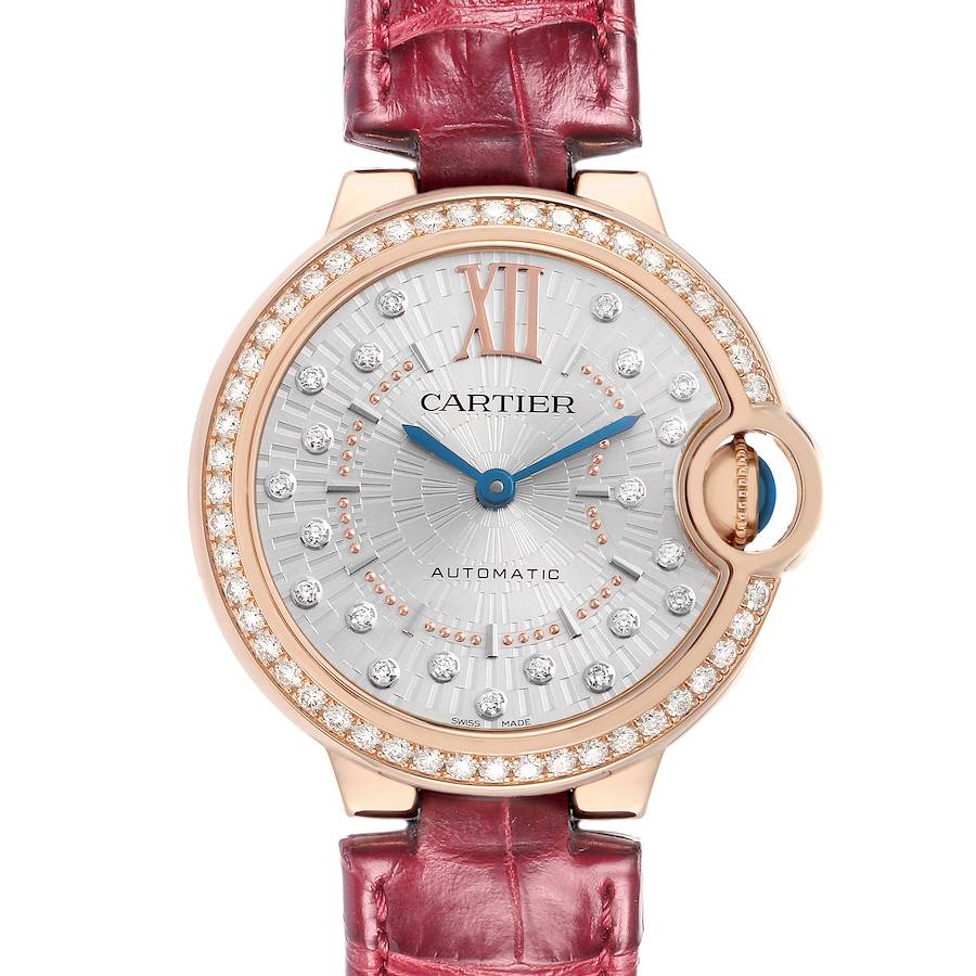 The Cartier Ballon Bleu WJBB0080 Women's Rose Gold Silver Dial watch is shown from the front, highlighting its jeweled bezel, dial, hands, and red leather strap.