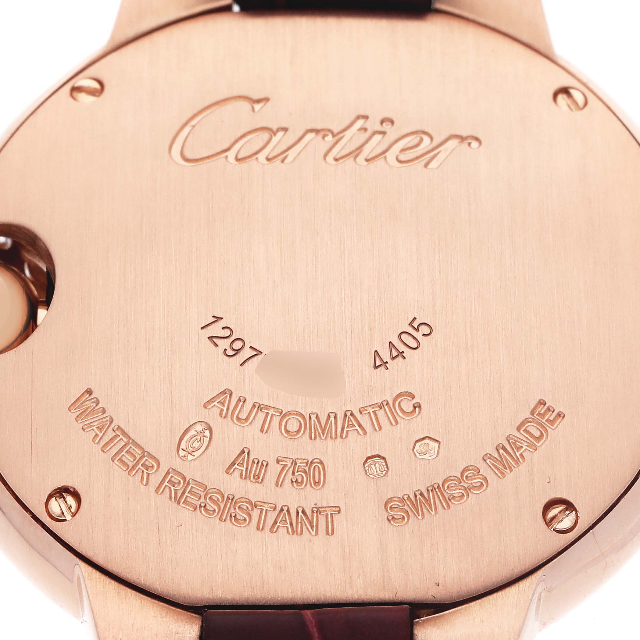 The image shows the back of a Cartier Ballon Bleu WJBB0080 Women
s Rose Gold Silver Dial watch with engravings about its specifications.