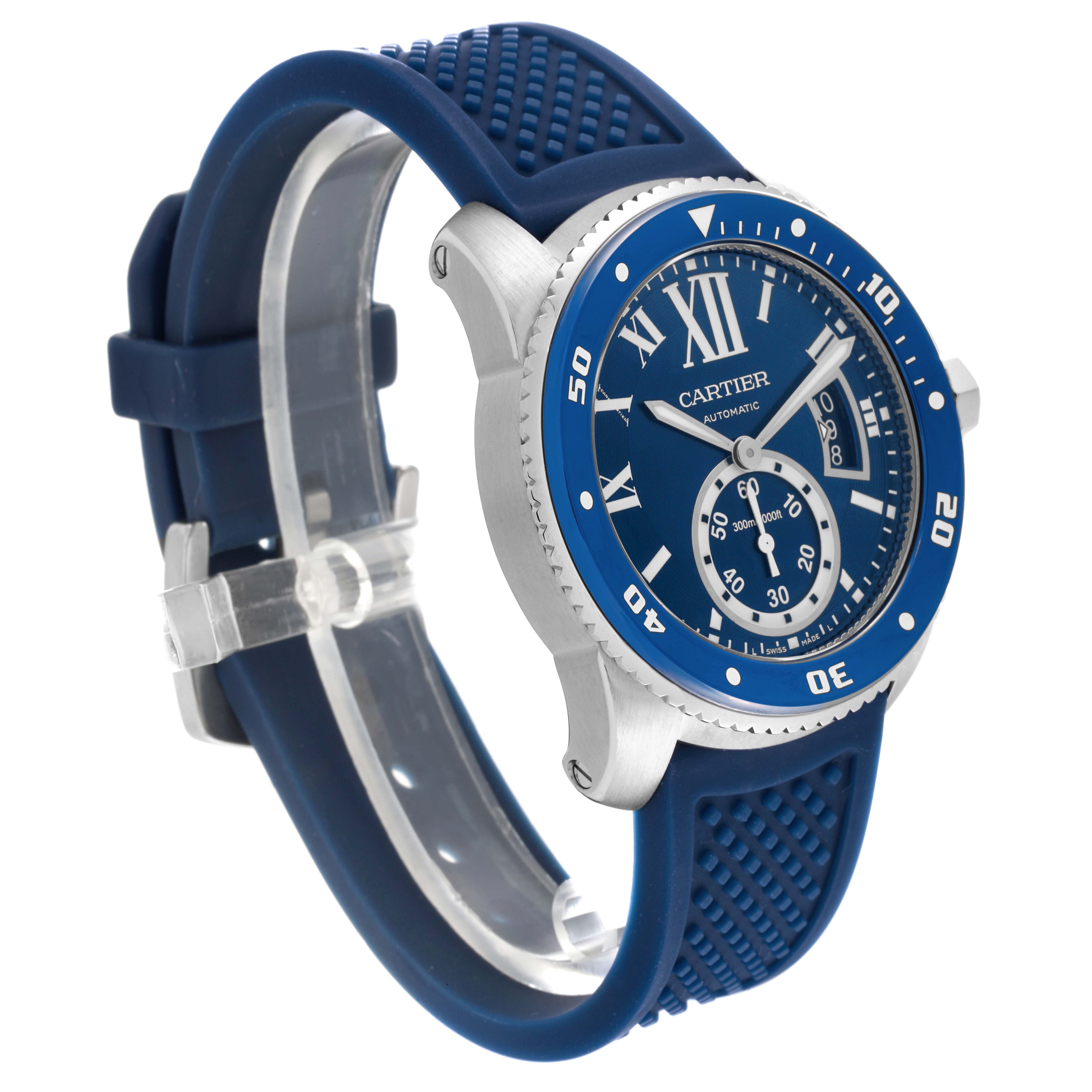 This Calibre de Cartier by Cartier is shown at a three-quarter angle showcasing its blue dial, bezel, and strap.
