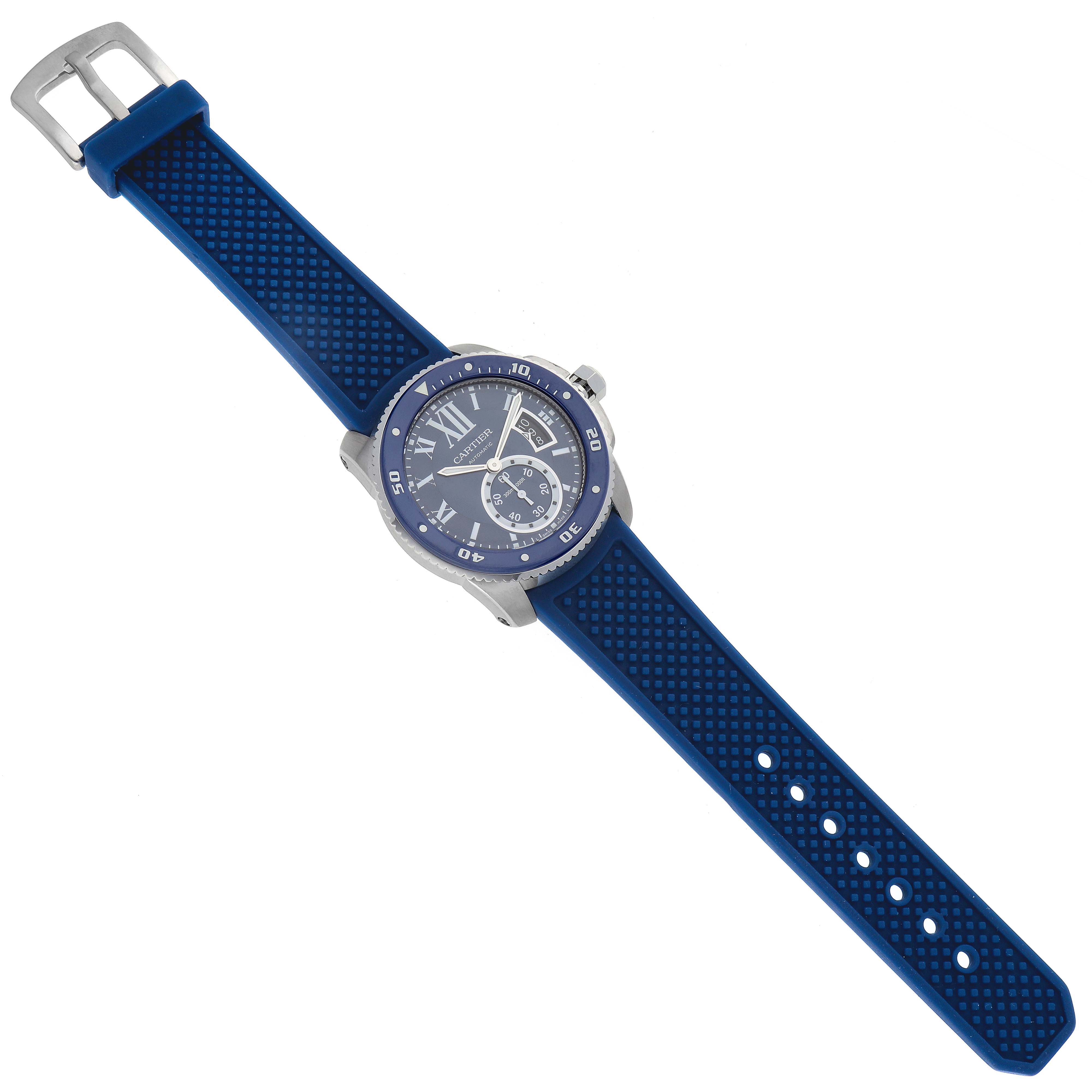 The image shows the front view of a Calibre de Cartier watch by Cartier with a blue strap and a stainless steel case.