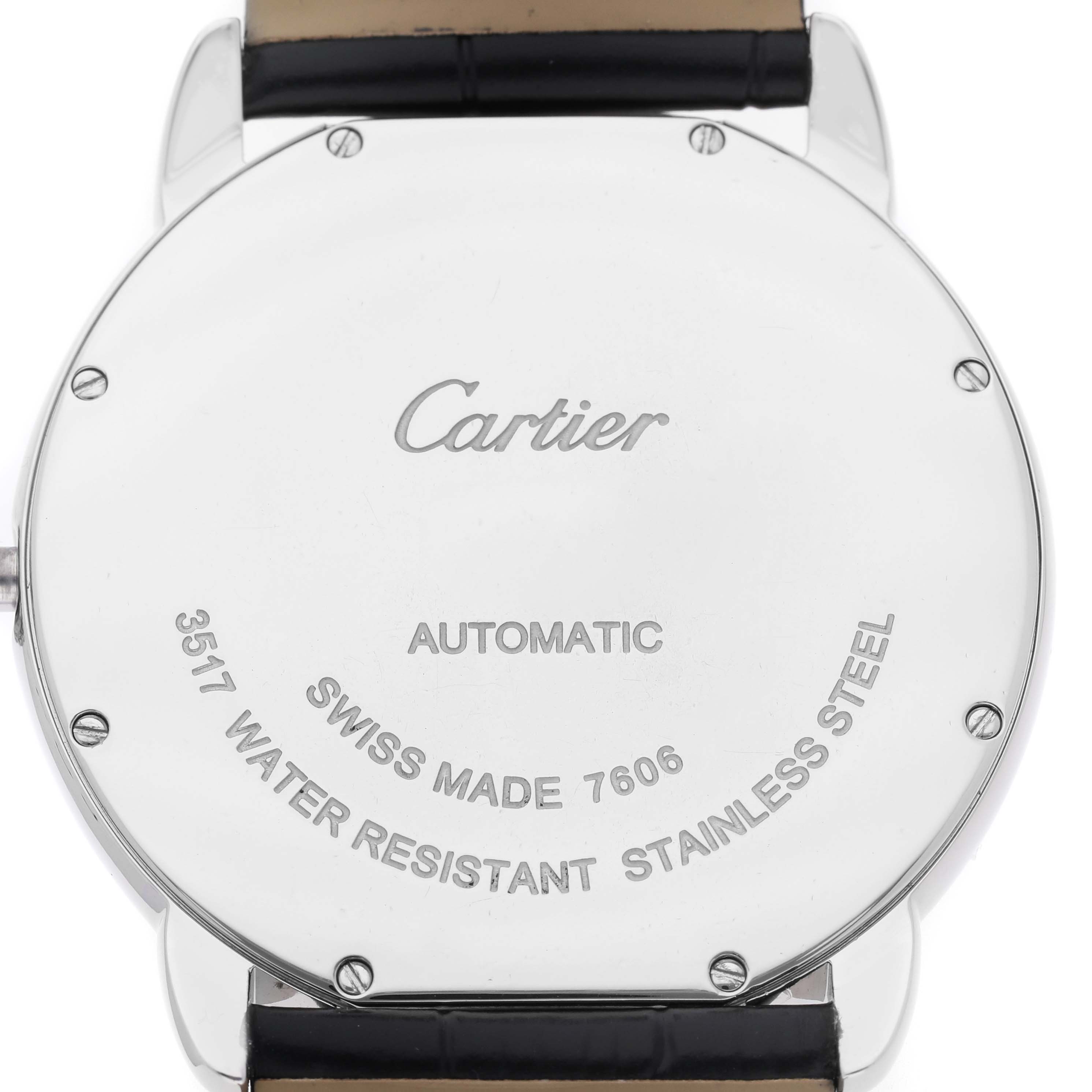 The image shows the back of a Cartier Ronde W6701010 Men's Stainless Steel Silver Dial watch, highlighting engravings and a leather strap attachment.