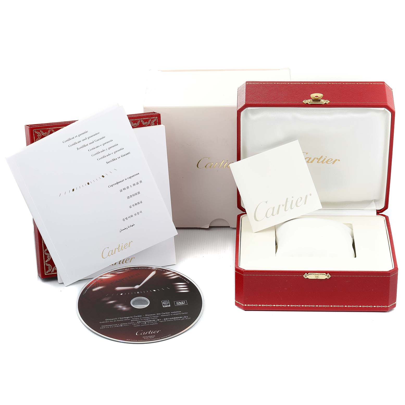 The image shows the packaging, warranty card, manuals, and a CD for the Cartier Santos Demoiselle W25065Z5 Women
s Stainless Steel Silver Dial W25065Z5 Women
s Stainless Steel Silver Dial watch, all displayed from a top angle.