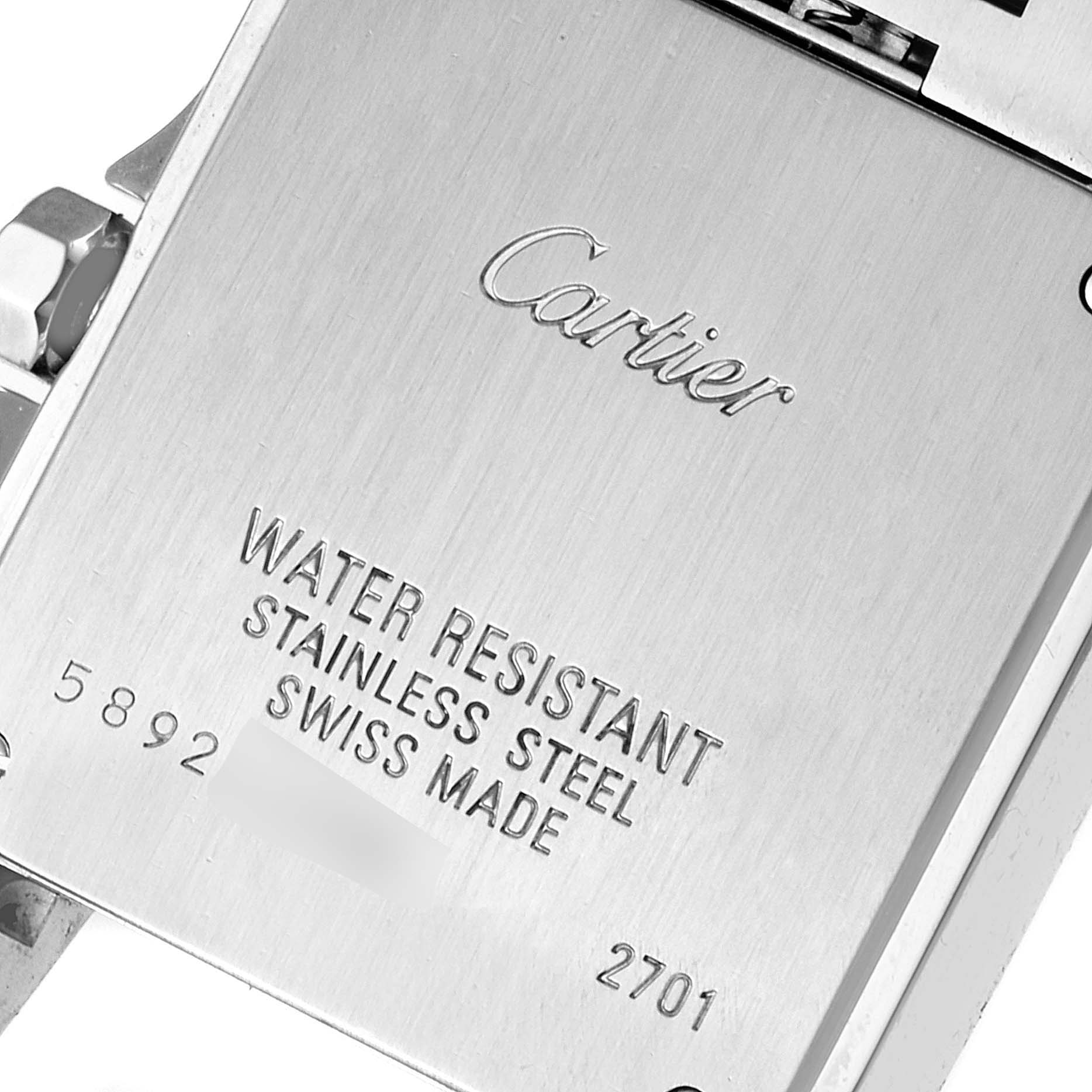 The image shows the engraved back case of a Cartier Santos Demoiselle W25065Z5 Women
s Stainless Steel Silver Dial W25065Z5 Women
s Stainless Steel Silver Dial watch, detailing water resistance and stainless steel material.