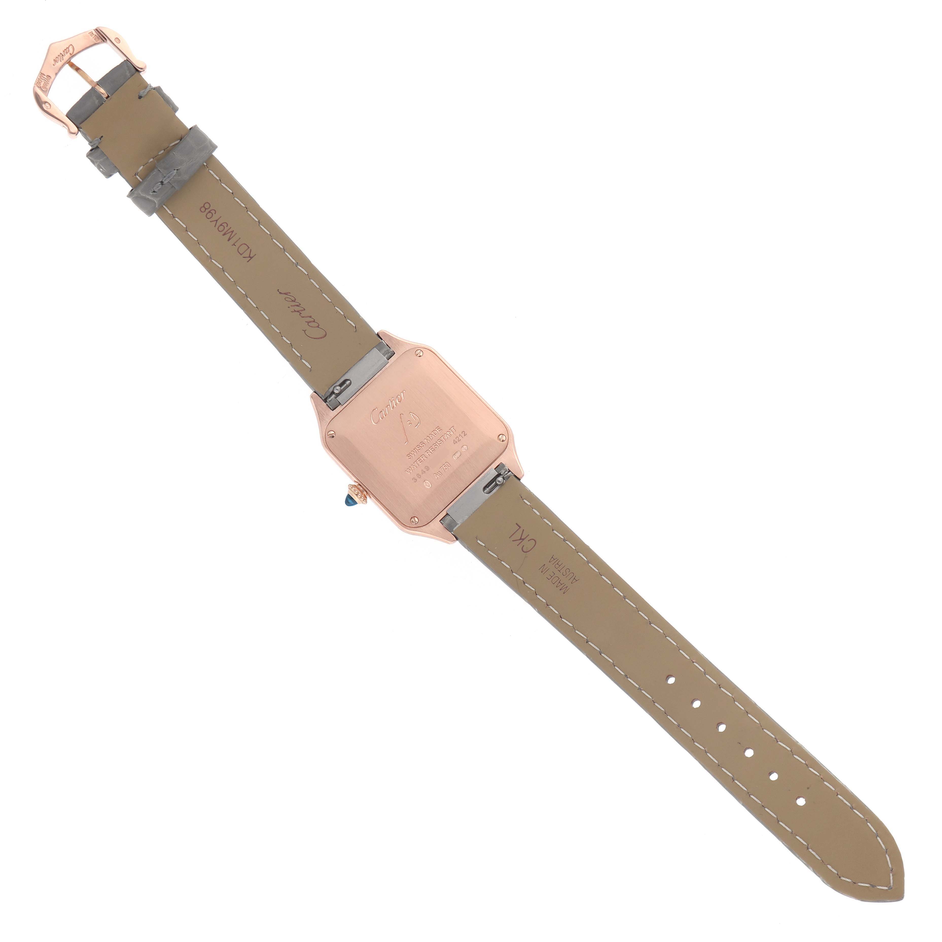 The image shows the back view of a Cartier Santos Dumont WGSA0022 Men's Rose Gold Silver Dial watch, highlighting the case back and leather strap.