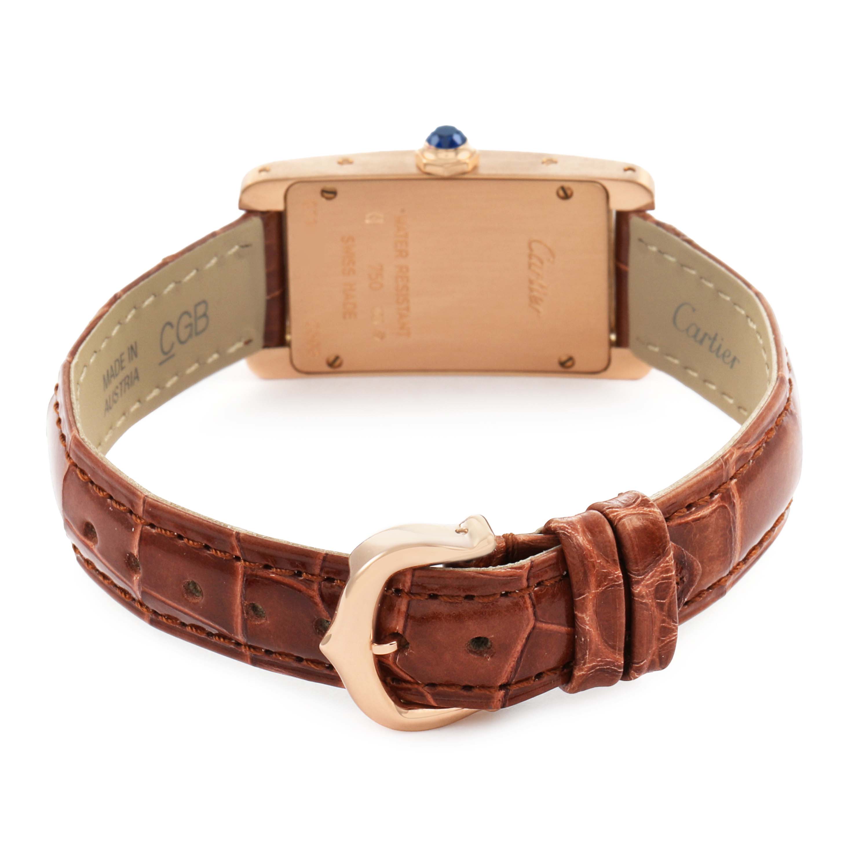 The Cartier Tank Americaine W2607456 Women's Rose Gold Silver Dial watch is shown from the back, highlighting the case, crown, and leather strap with a buckle.