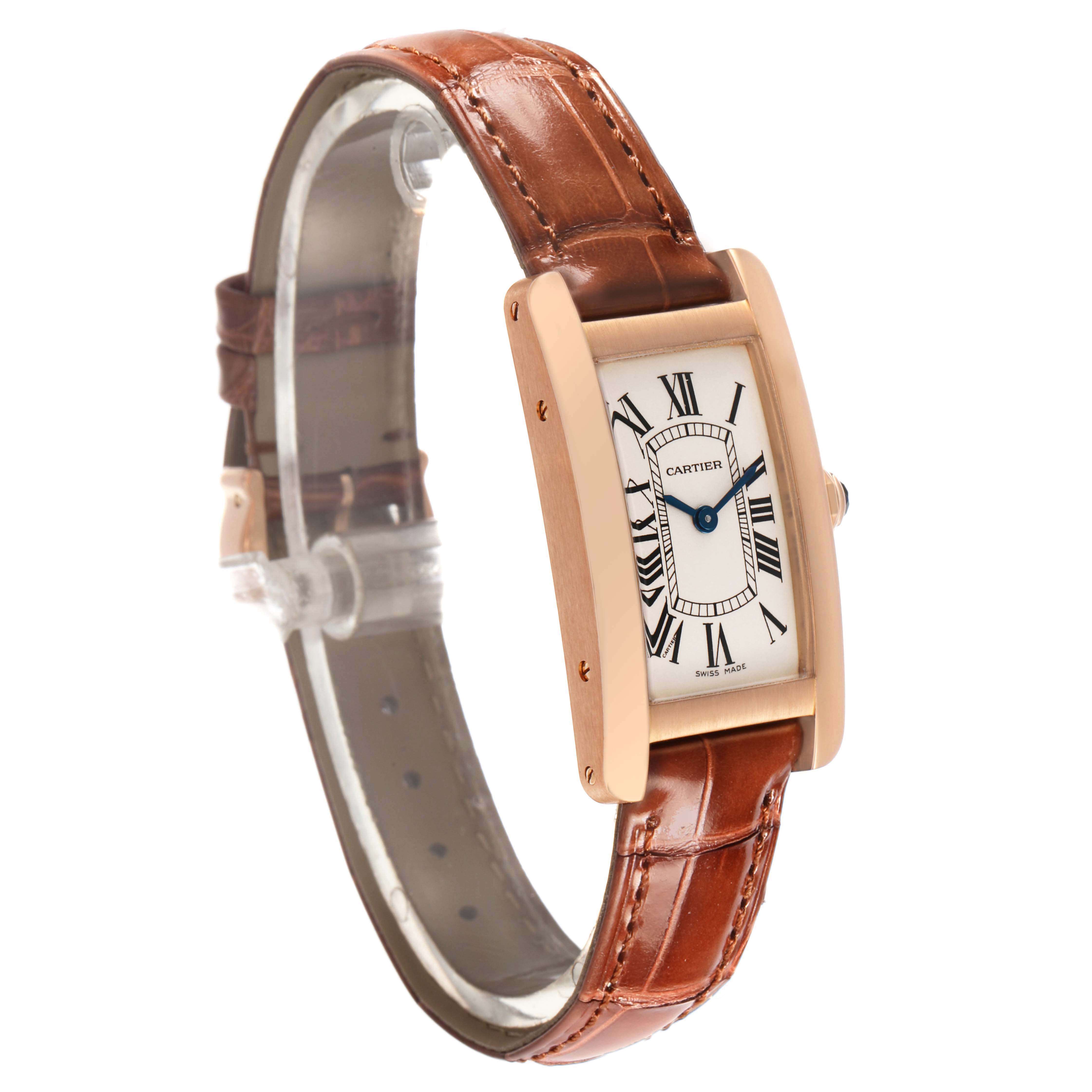 The Cartier Tank Americaine W2607456 Women's Rose Gold Silver Dial watch is shown at a three-quarter angle, highlighting its rectangular case and leather strap.