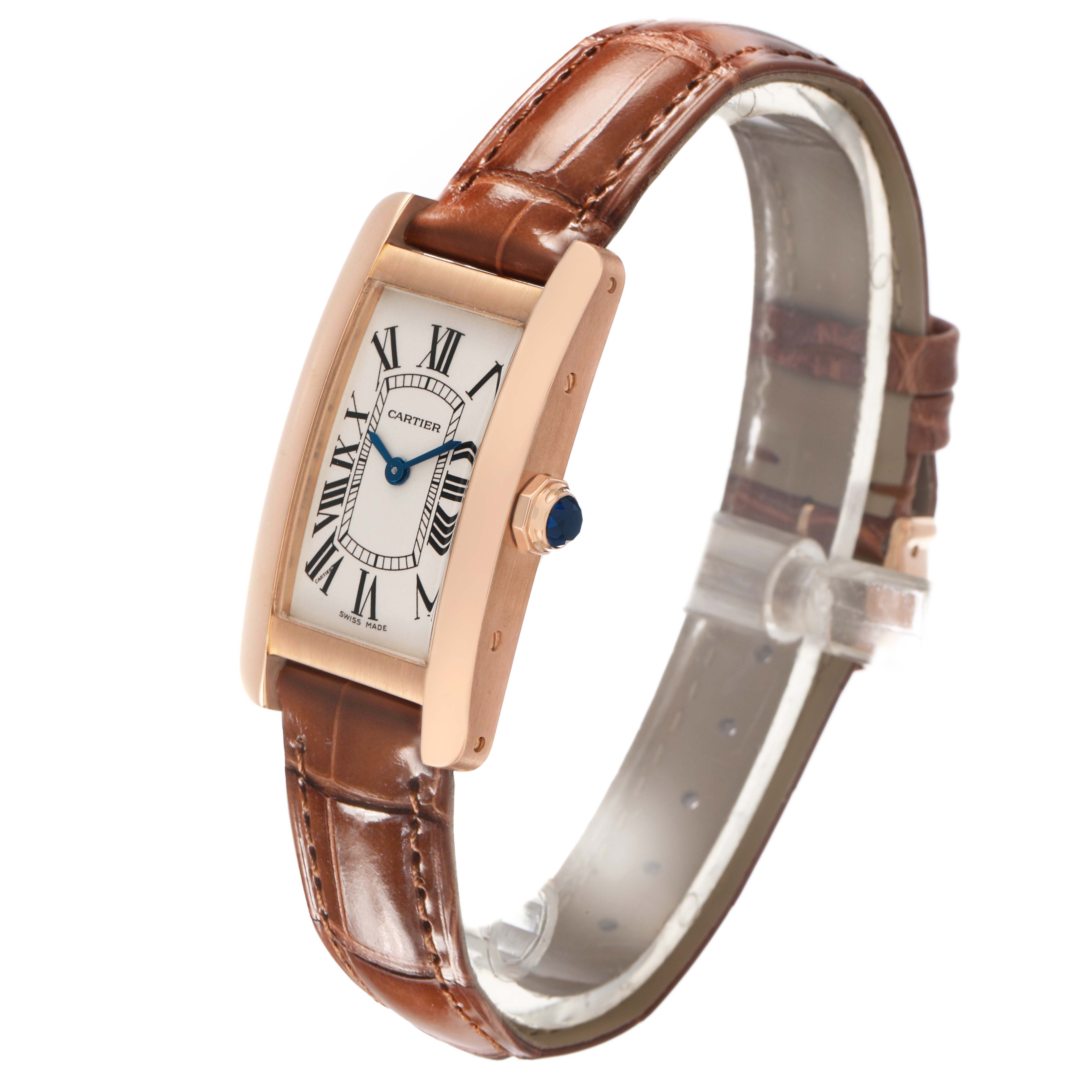 The Cartier Tank Américaine watch is shown at a three-quarter angle, highlighting the face, case, and brown leather strap.