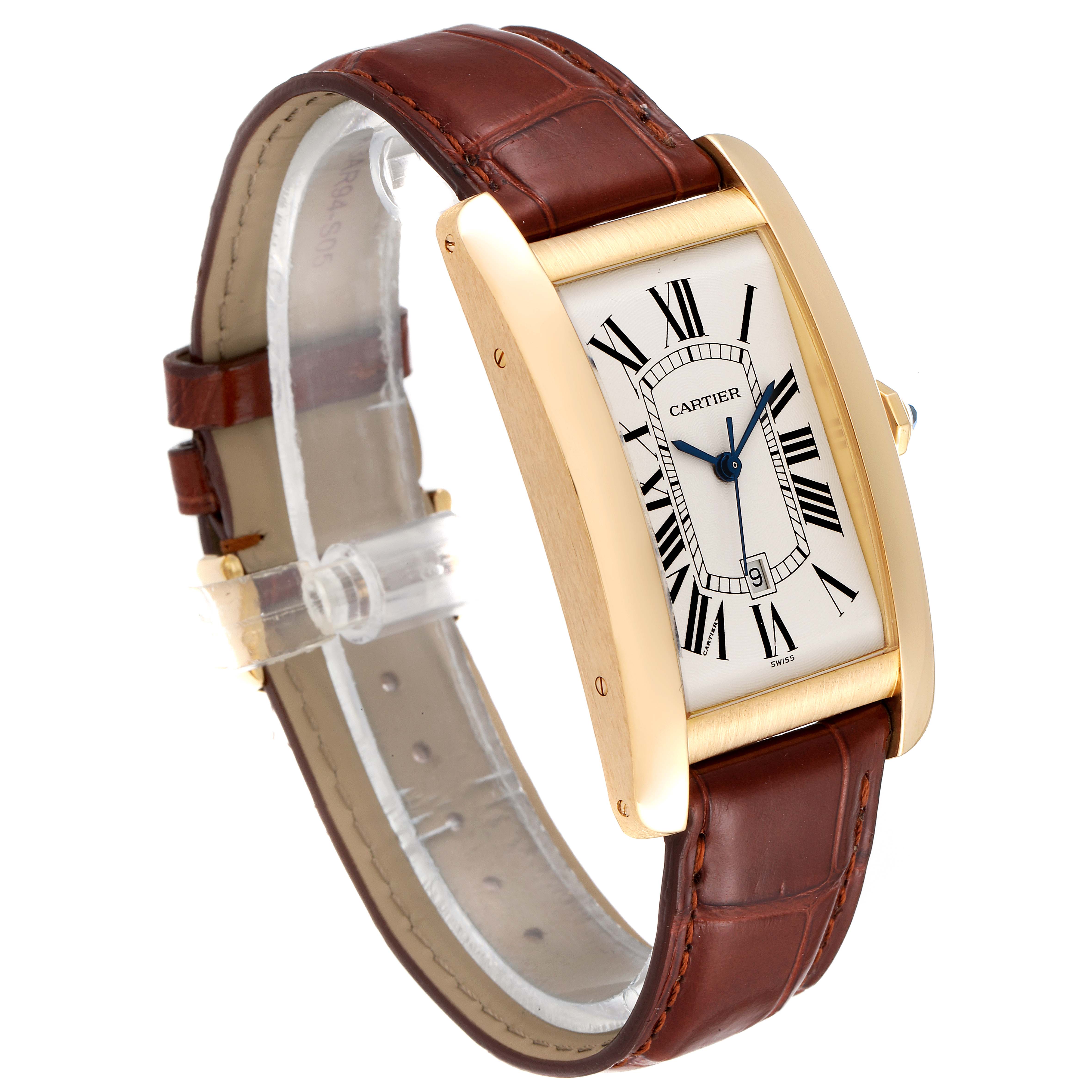 This Cartier Tank Americaine W2603156 Men
s Yellow Gold Silver Dial W2603156 Men
s Yellow Gold Silver Dial watch is shown at an angle highlighting its gold case, Roman numeral dial, and brown leather strap.