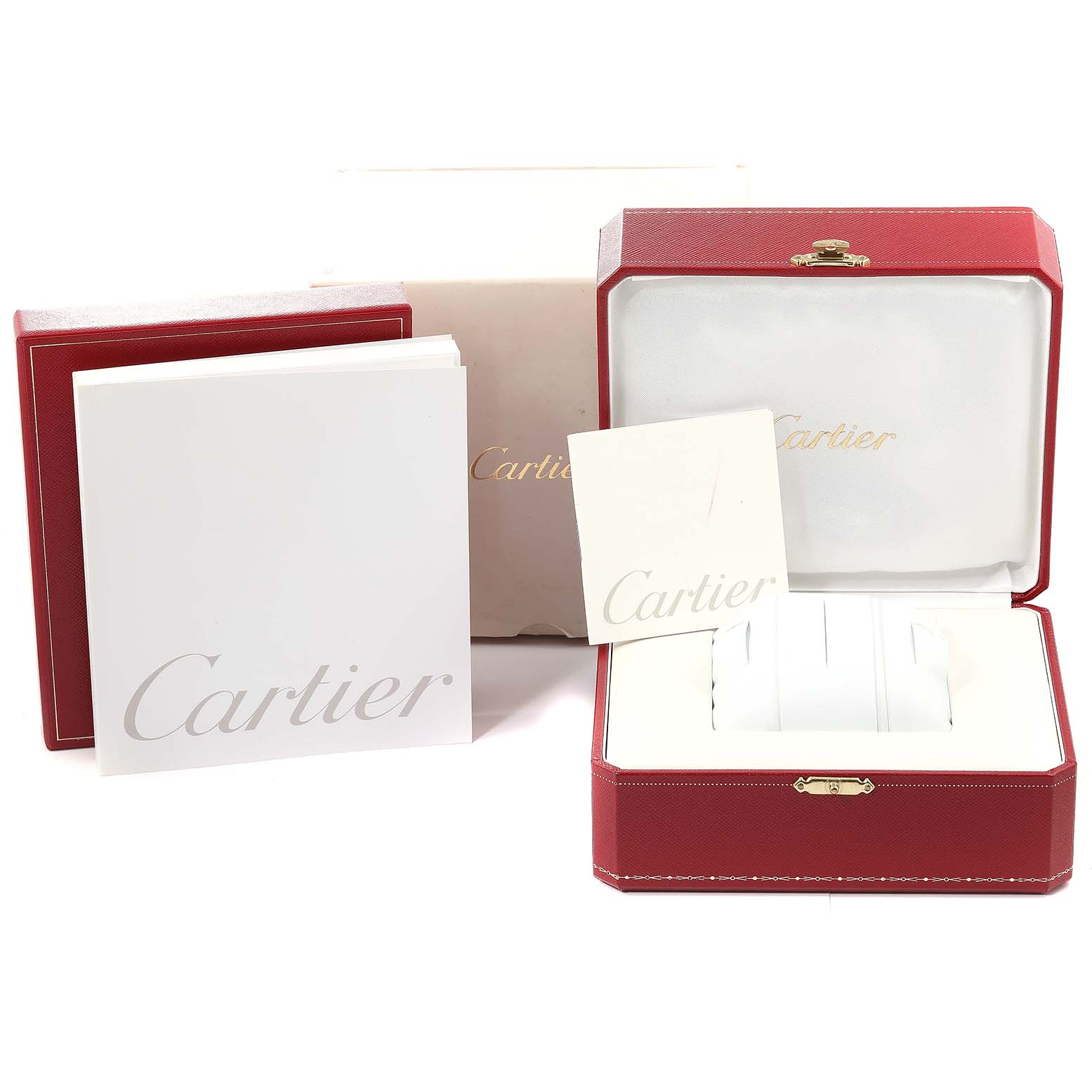 The image shows the packaging and documentation for the Cartier Tank Americaine W2603156 Men's Yellow Gold Silver Dial W2603156 Men's Yellow Gold Silver Dial watch, including a red box, white booklets, and outer boxes.