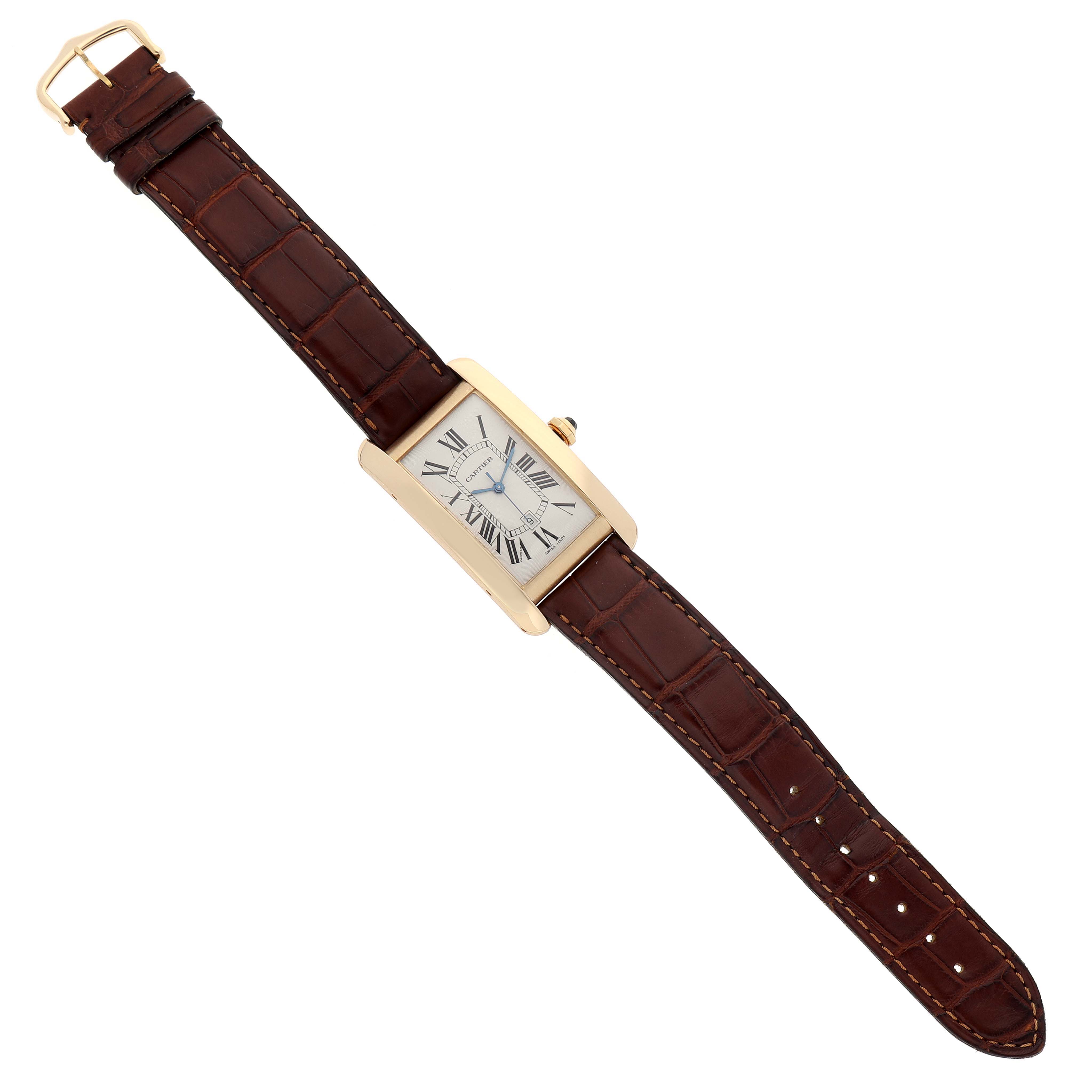 The Cartier Tank Americaine W2603156 Men's Yellow Gold Silver Dial W2603156 Men's Yellow Gold Silver Dial watch is shown from a top-down angle, displaying the face and leather strap.