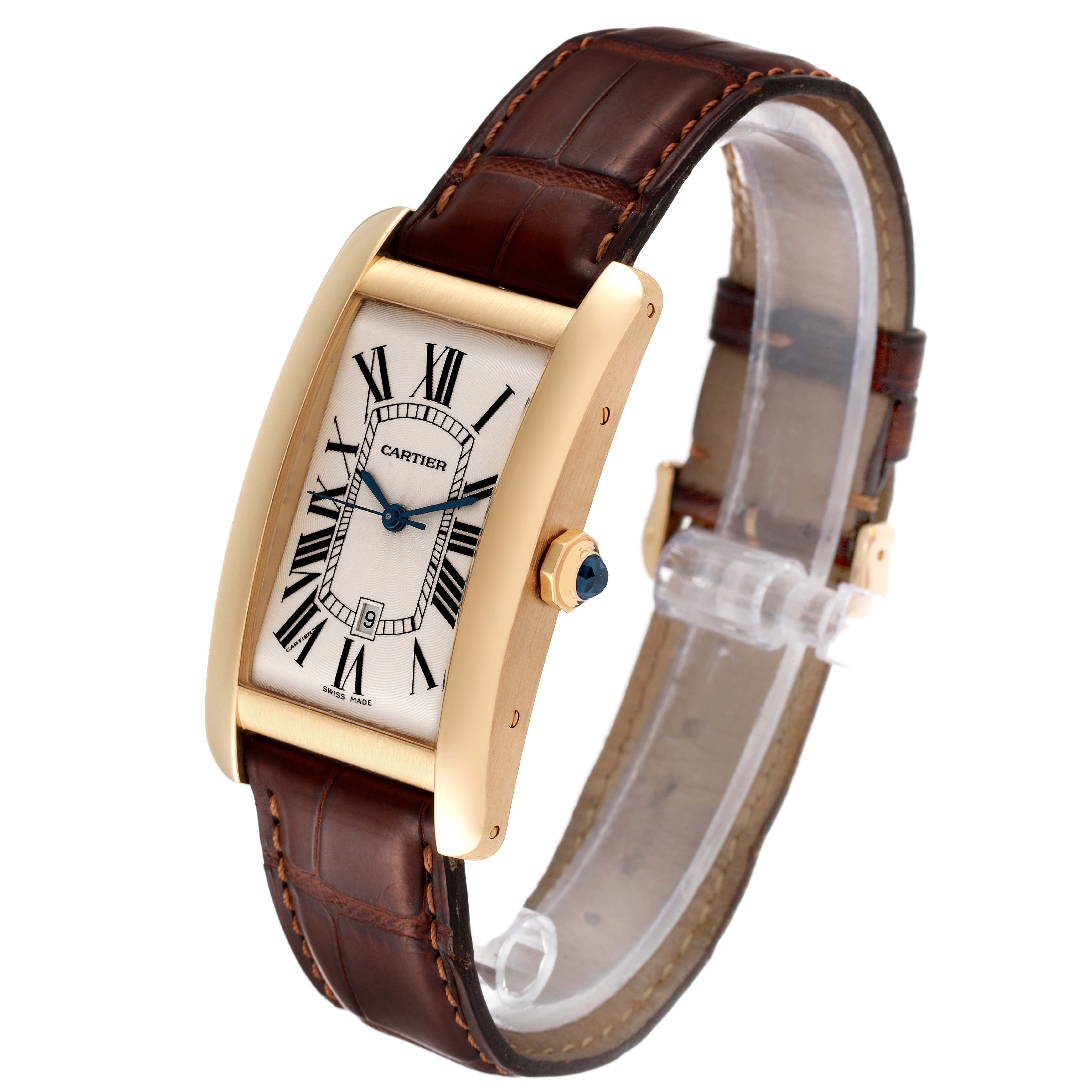 The Tank Americaine by Cartier is shown at a slight angle, displaying its rectangular face, gold casing, and brown leather strap.