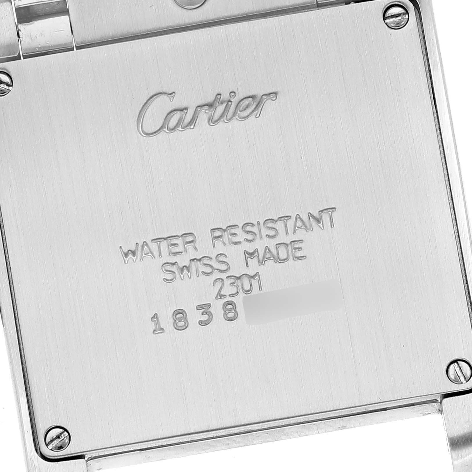 The image shows the back case of the Tank Francaise model watch by Cartier, highlighting the engraved details and screws.