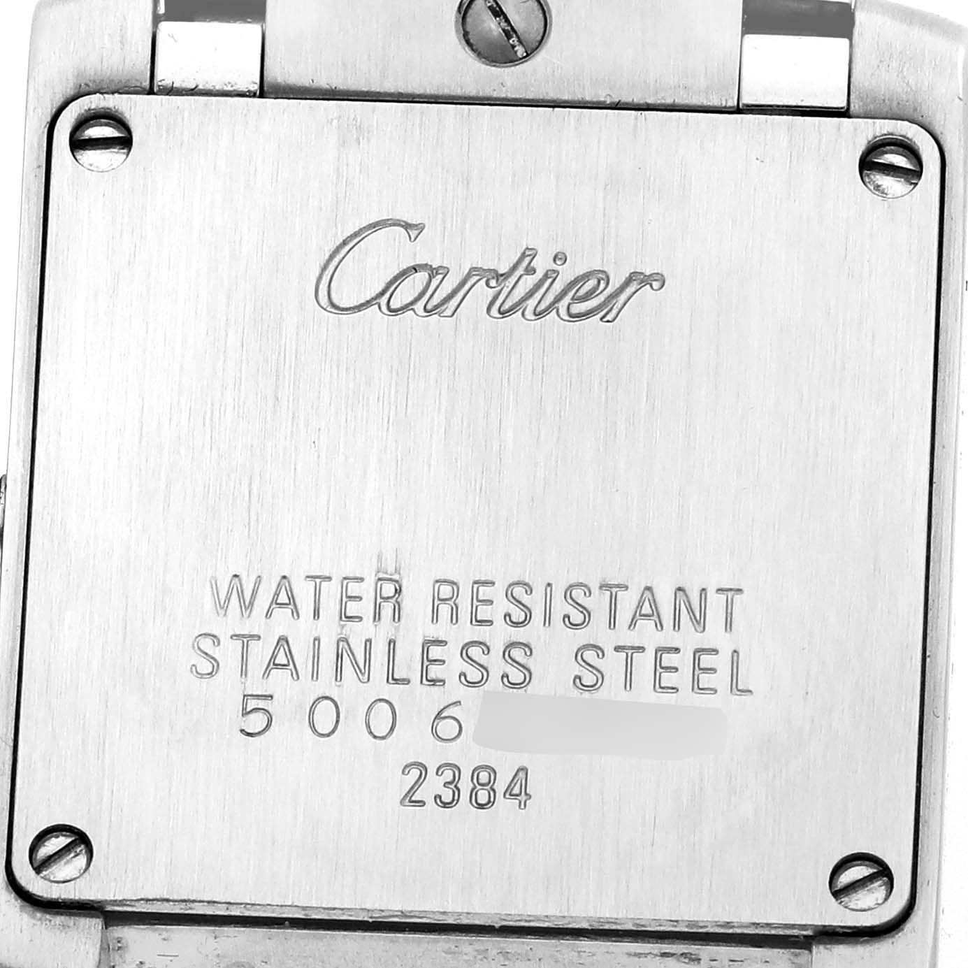 The image shows the back of a Cartier Tank Francaise W51008Q3 Women
s Stainless Steel Silver Dial watch, highlighting its stainless steel case and water resistance markings.