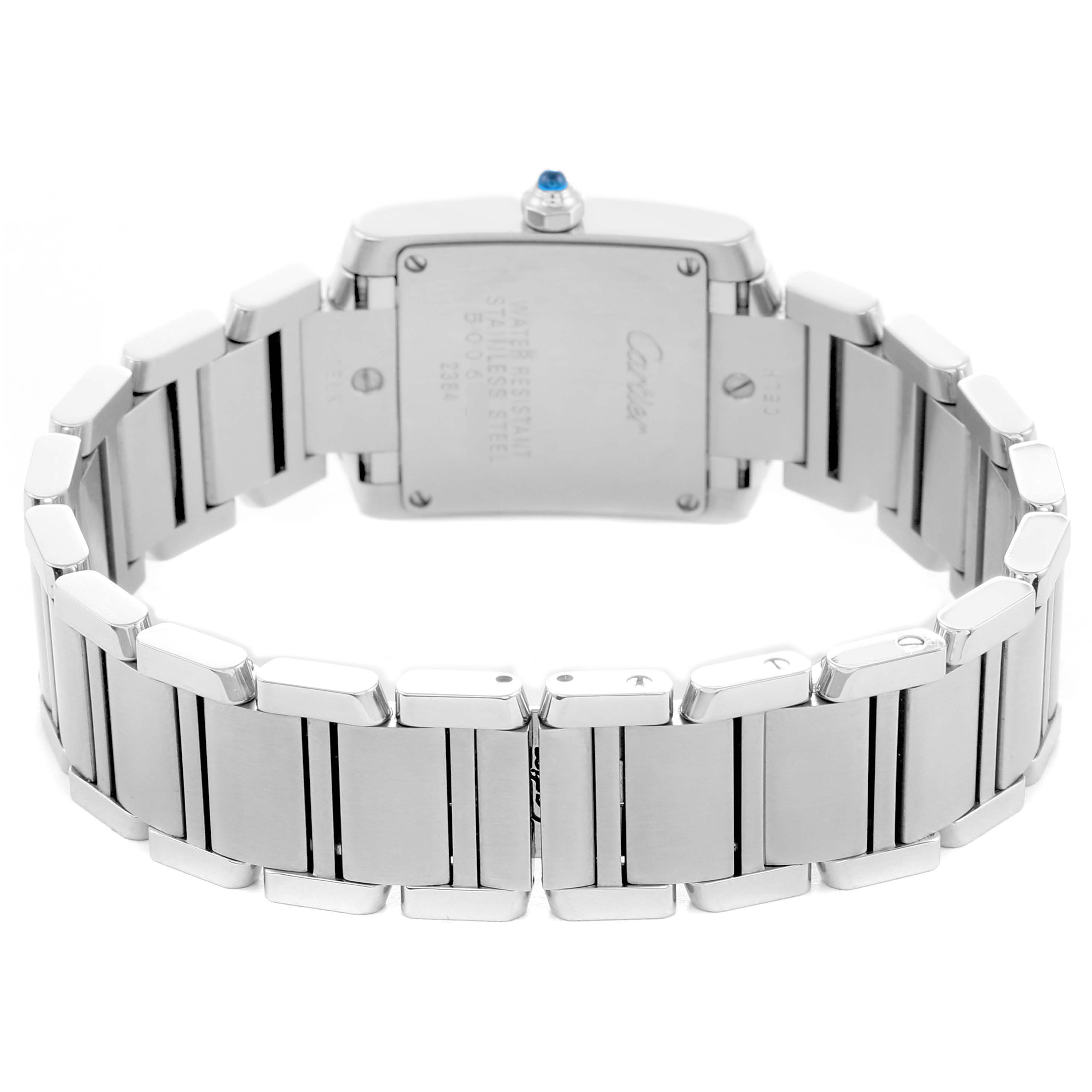 The image shows the back view of a Cartier Tank Française watch, highlighting the stainless steel case back and bracelet.
