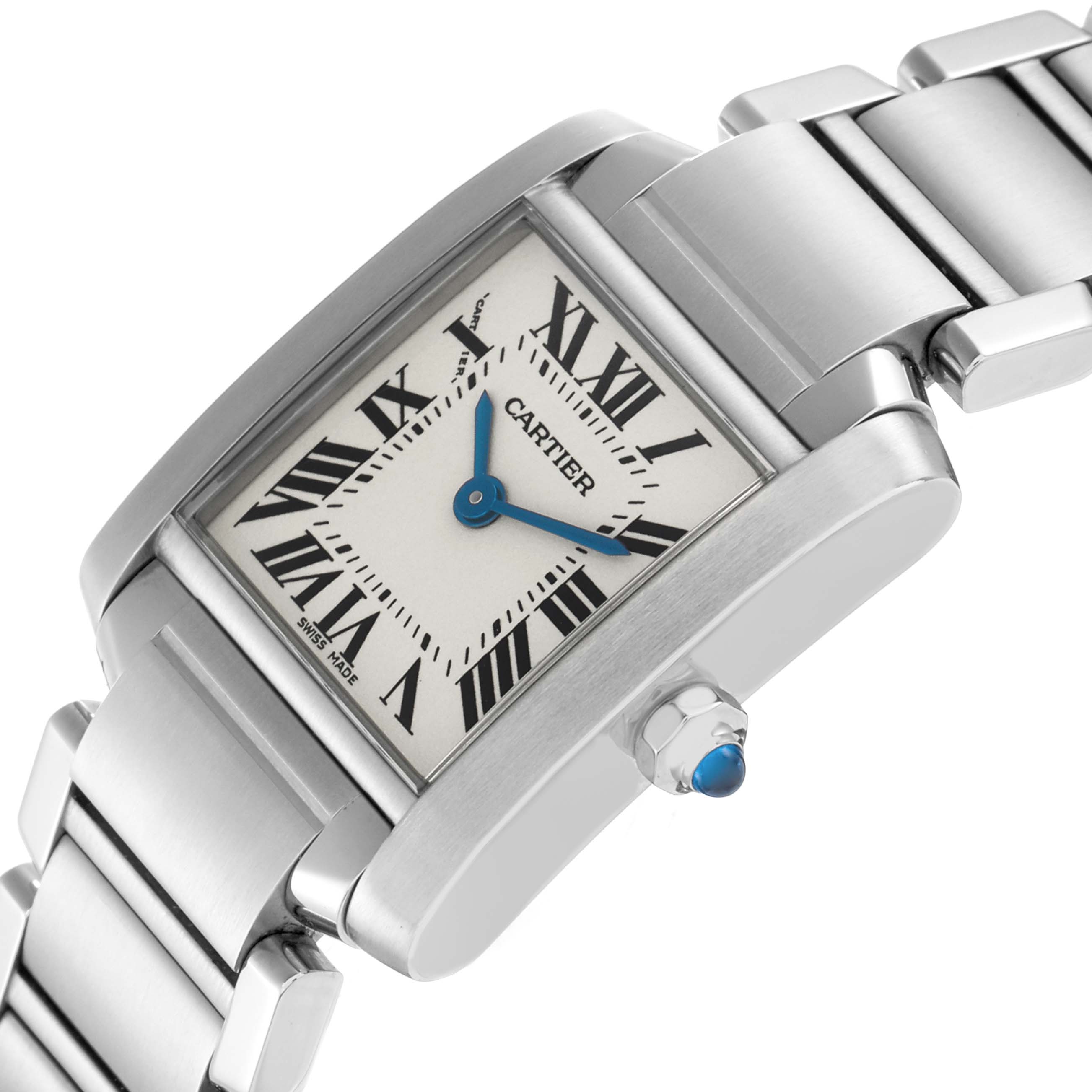 The Cartier Tank Française watch is shown at an angle highlighting its rectangular face, Roman numerals, blue hands, and metal bracelet.