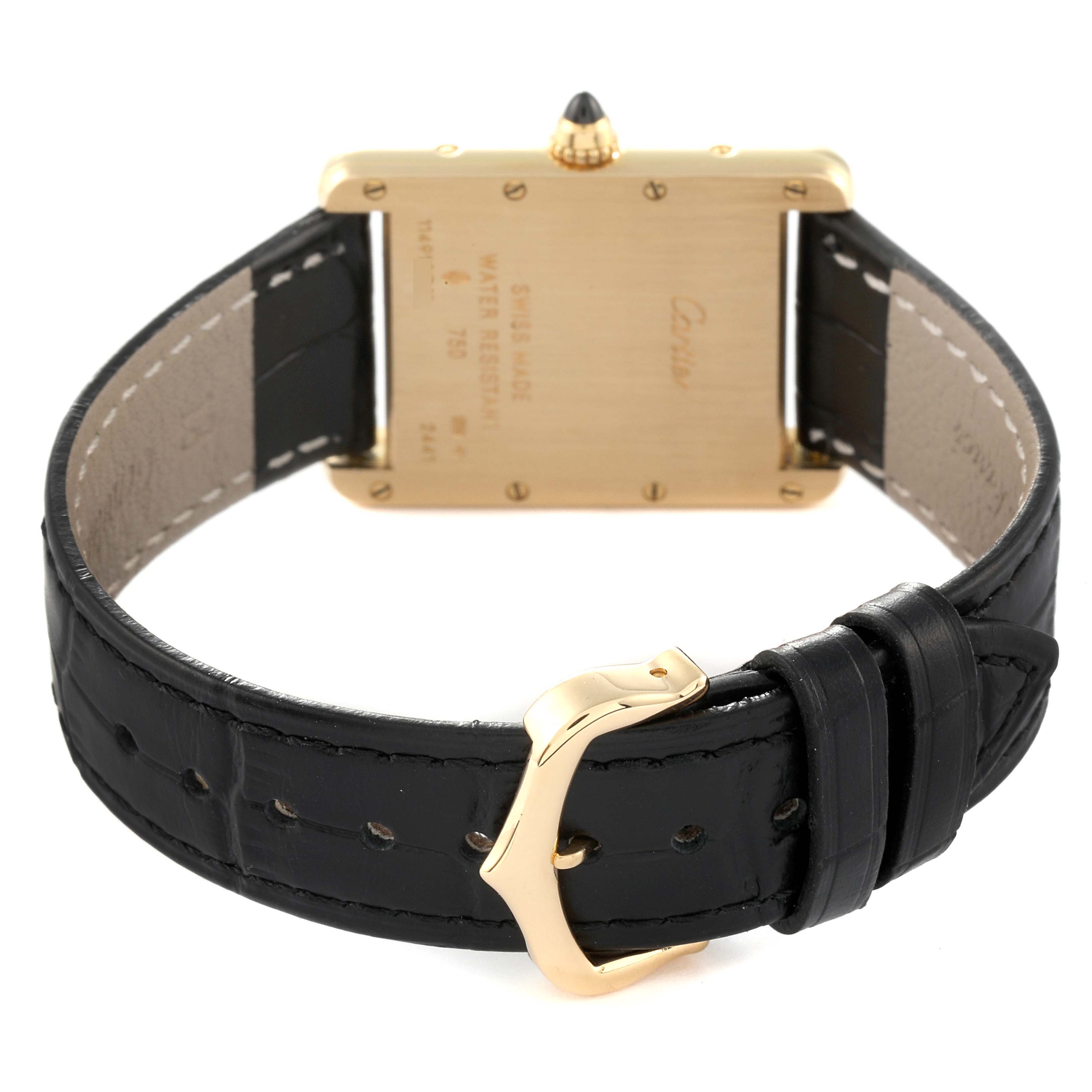 The image shows the back of a Cartier Tank Louis W1529756 Men
s Yellow Gold Silver Dial W1529756 Men
s Yellow Gold Silver Dial watch, highlighting its leather strap and gold-plated clasp.