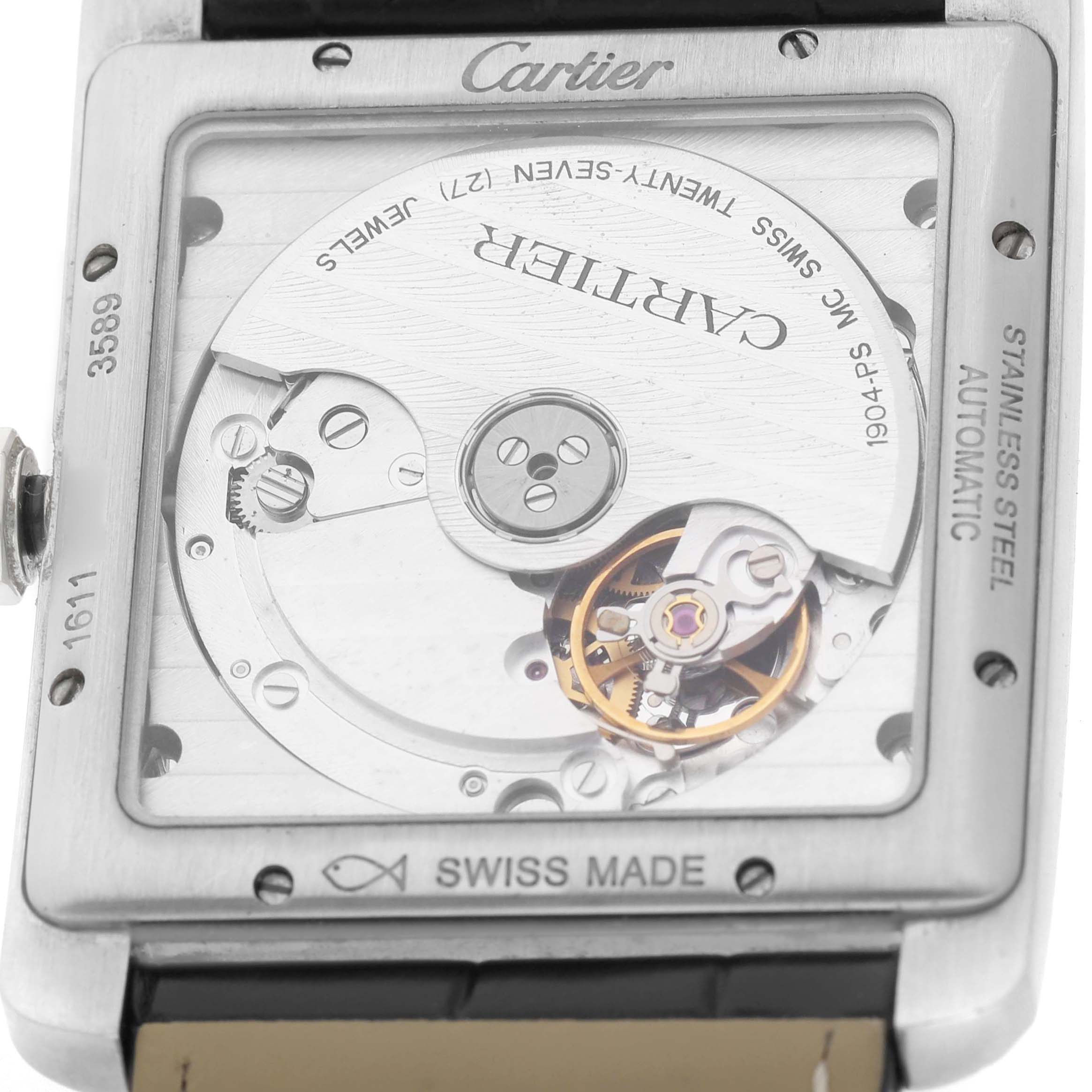 The image shows the back of a Cartier Tank MC W5330003 Men's Stainless Steel Silver Dial watch, highlighting the automatic movement and rotor components.