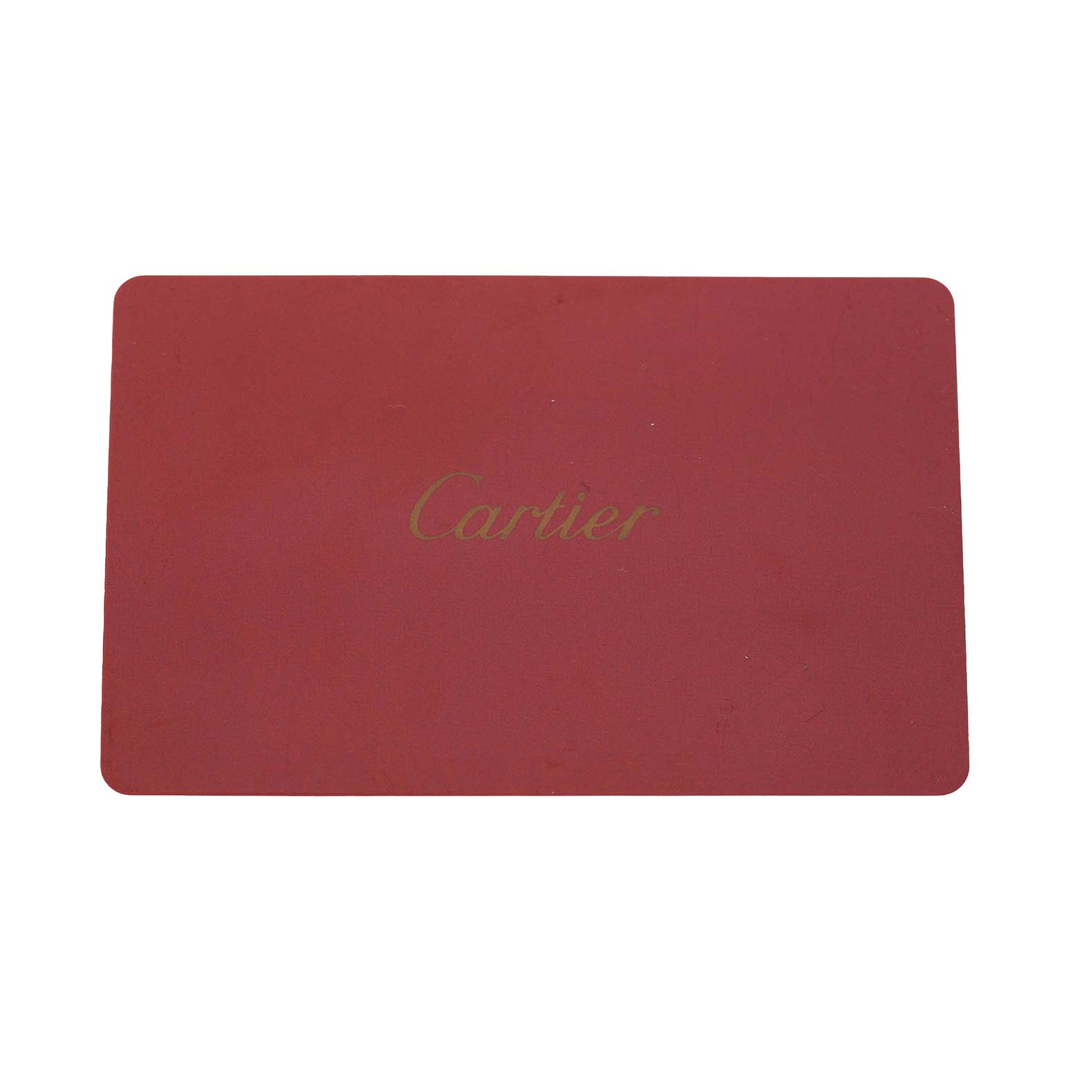 The image shows a red Cartier watch box, likely for the Tank MC model.