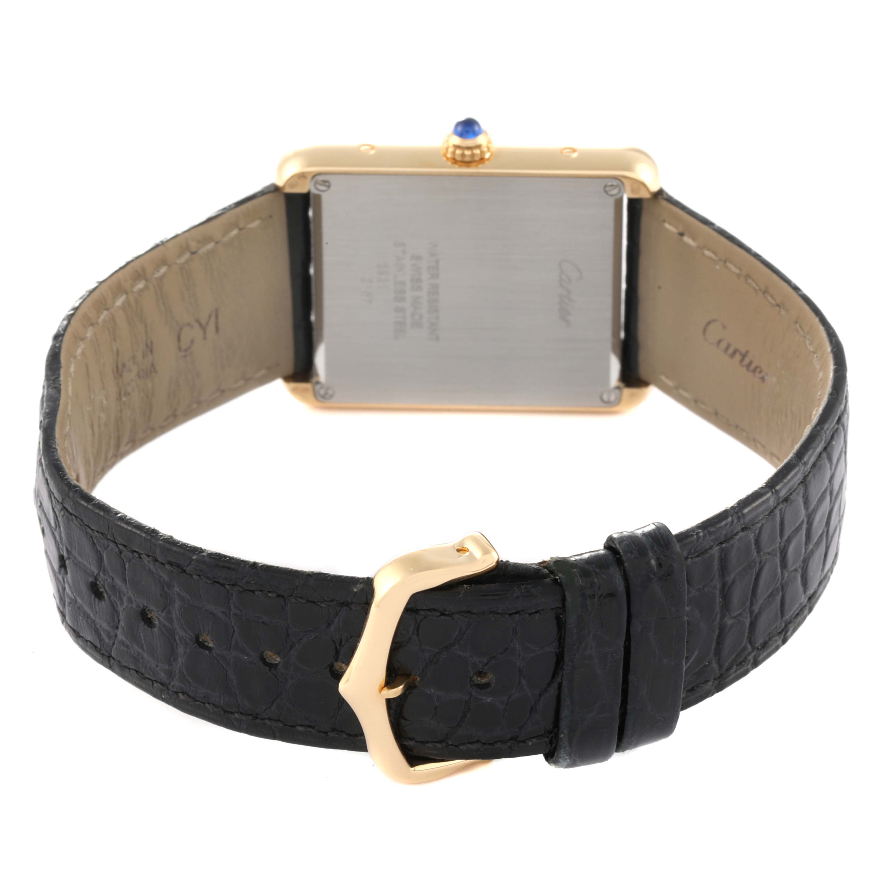 The image shows the back of the Cartier Tank Solo W5200004 Men's Yellow Gold Silver Dial W5200004 Men's Yellow Gold Silver Dial watch and its black leather strap, including the buckle.