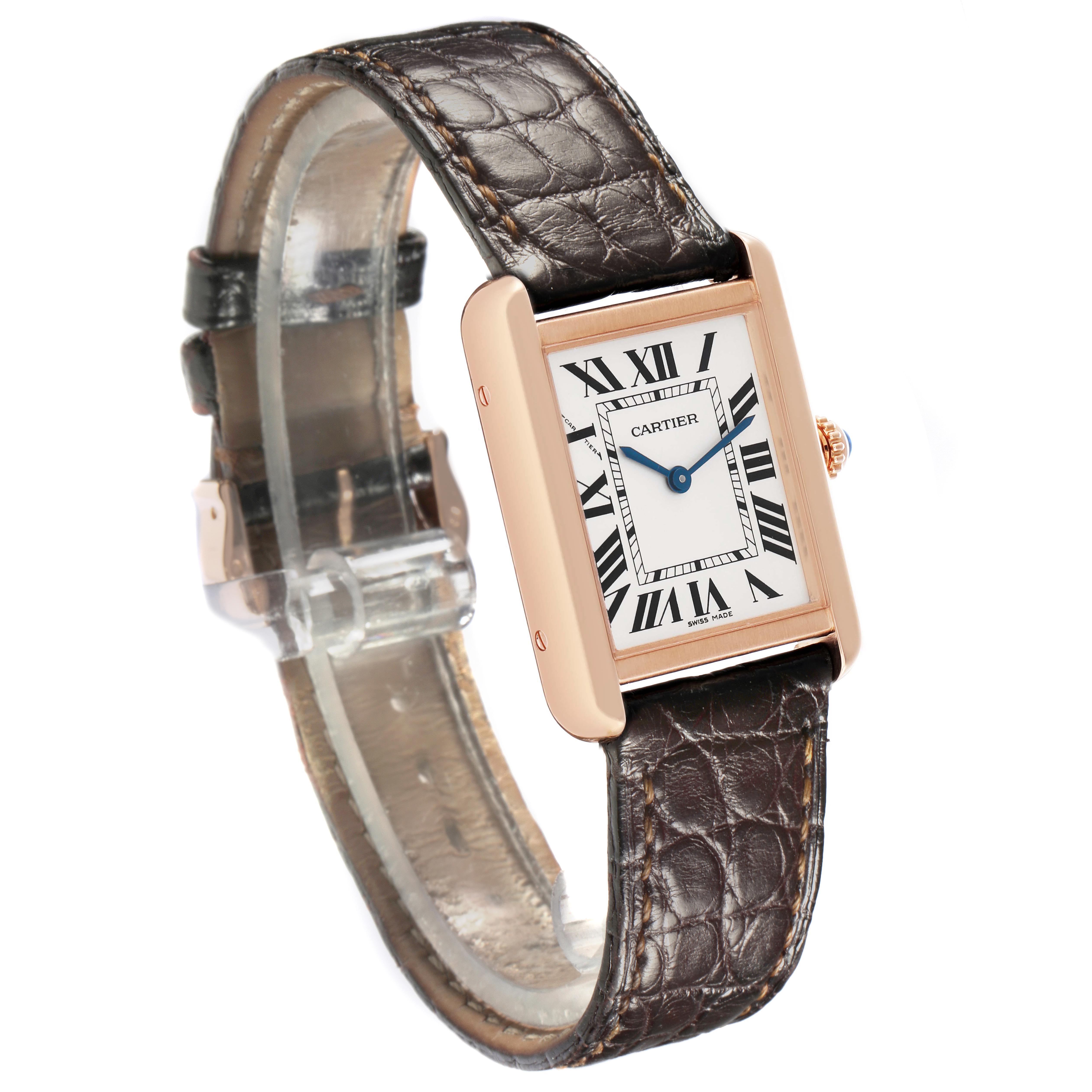 The Cartier Tank Solo W5200024 Women's Rose Gold Silver Dial watch is shown at an angled side view, highlighting its rectangular face, Roman numerals, and leather strap.