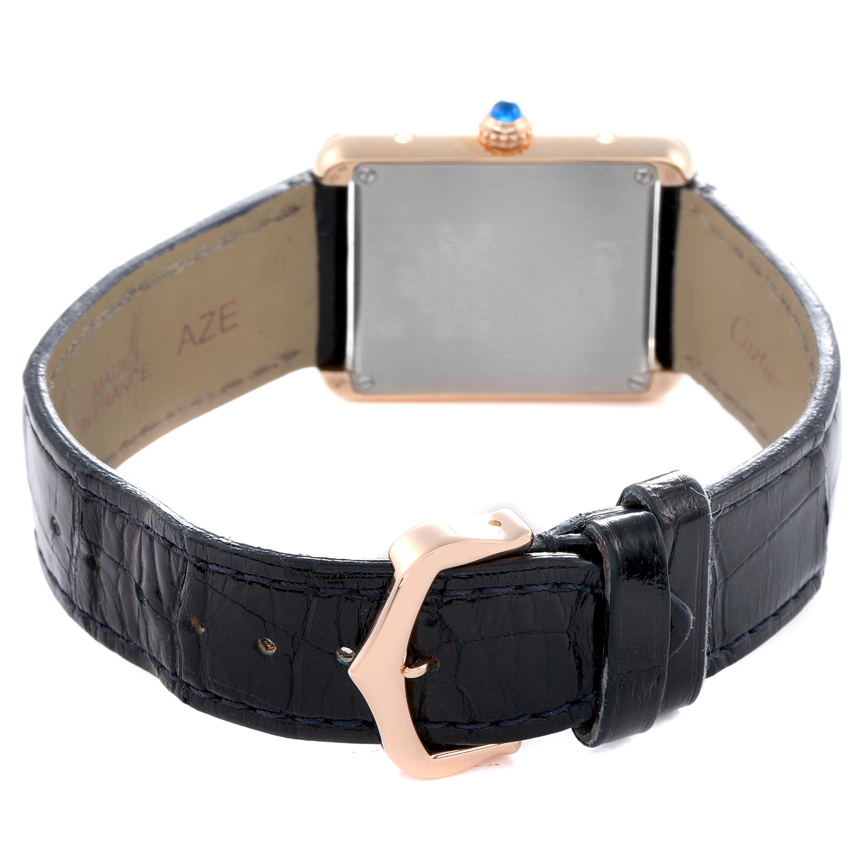 The Cartier Tank Solo W5200002 Women
s Rose Gold Silver Dial watch is shown from the back, featuring its case, crown, and leather strap with buckle.