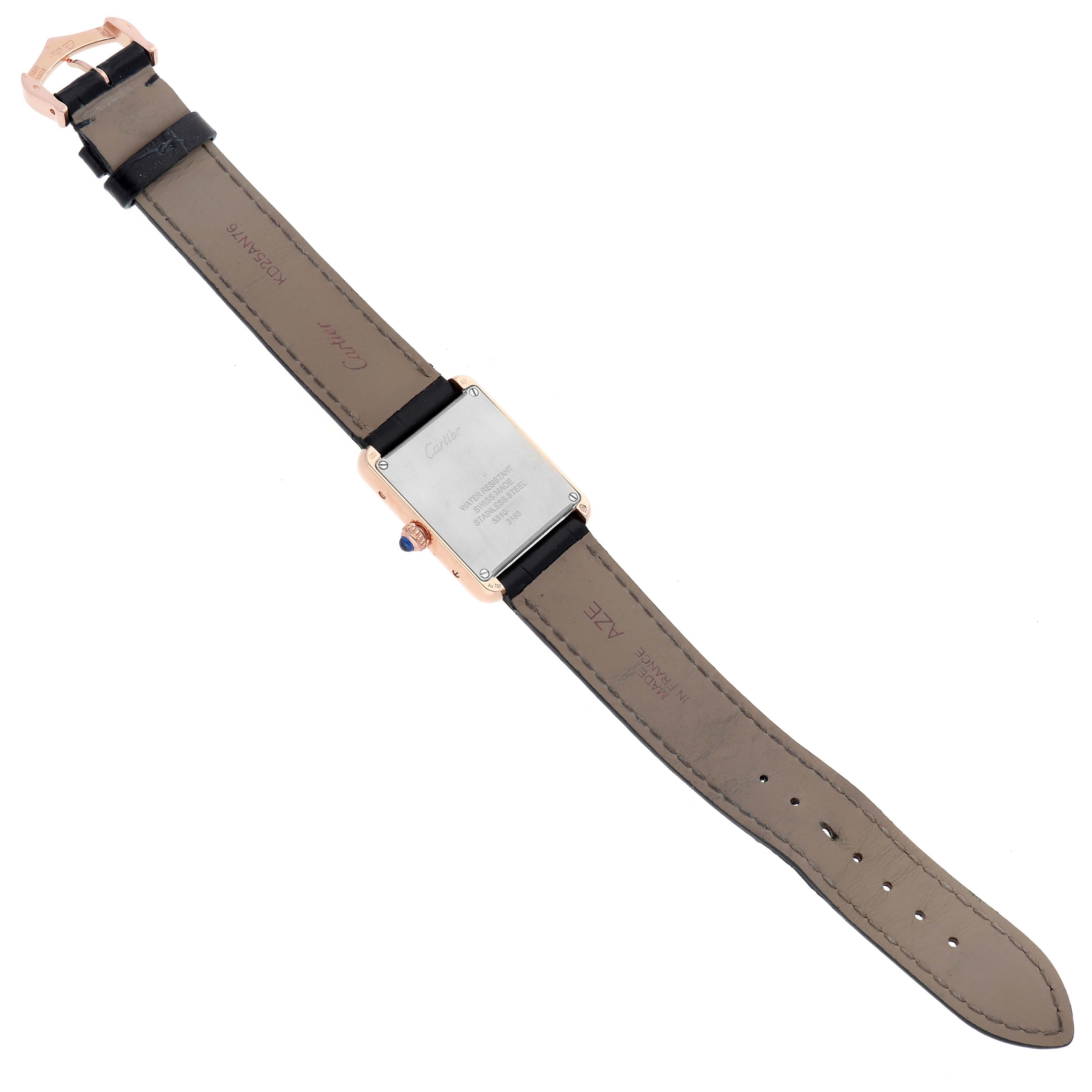 The image shows the back of a Cartier Tank Solo W5200002 Women
s Rose Gold Silver Dial watch and its leather strap fully extended.