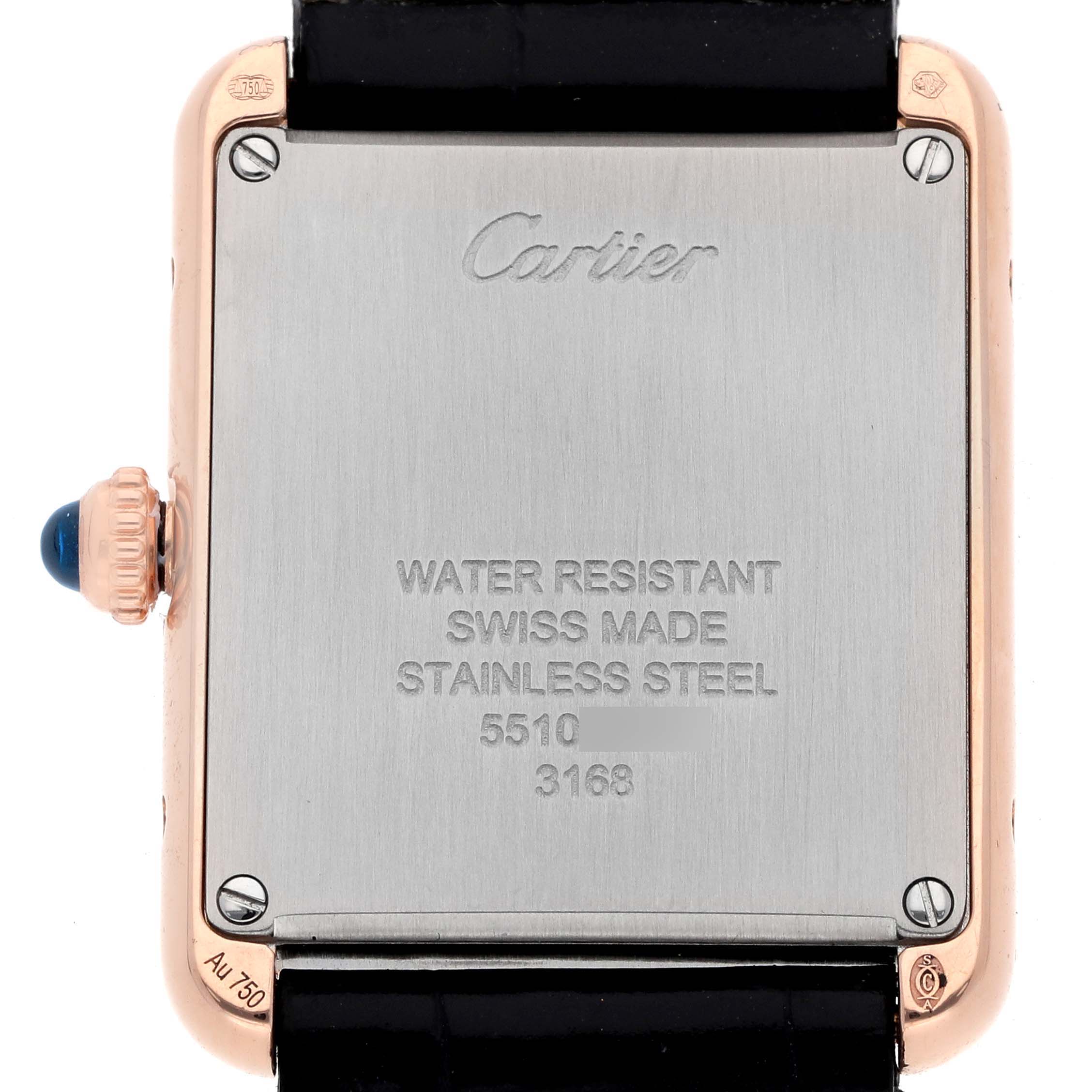 The image shows the back case of a Cartier Tank Solo W5200002 Women
s Rose Gold Silver Dial watch, featuring inscriptions and a visible crown.