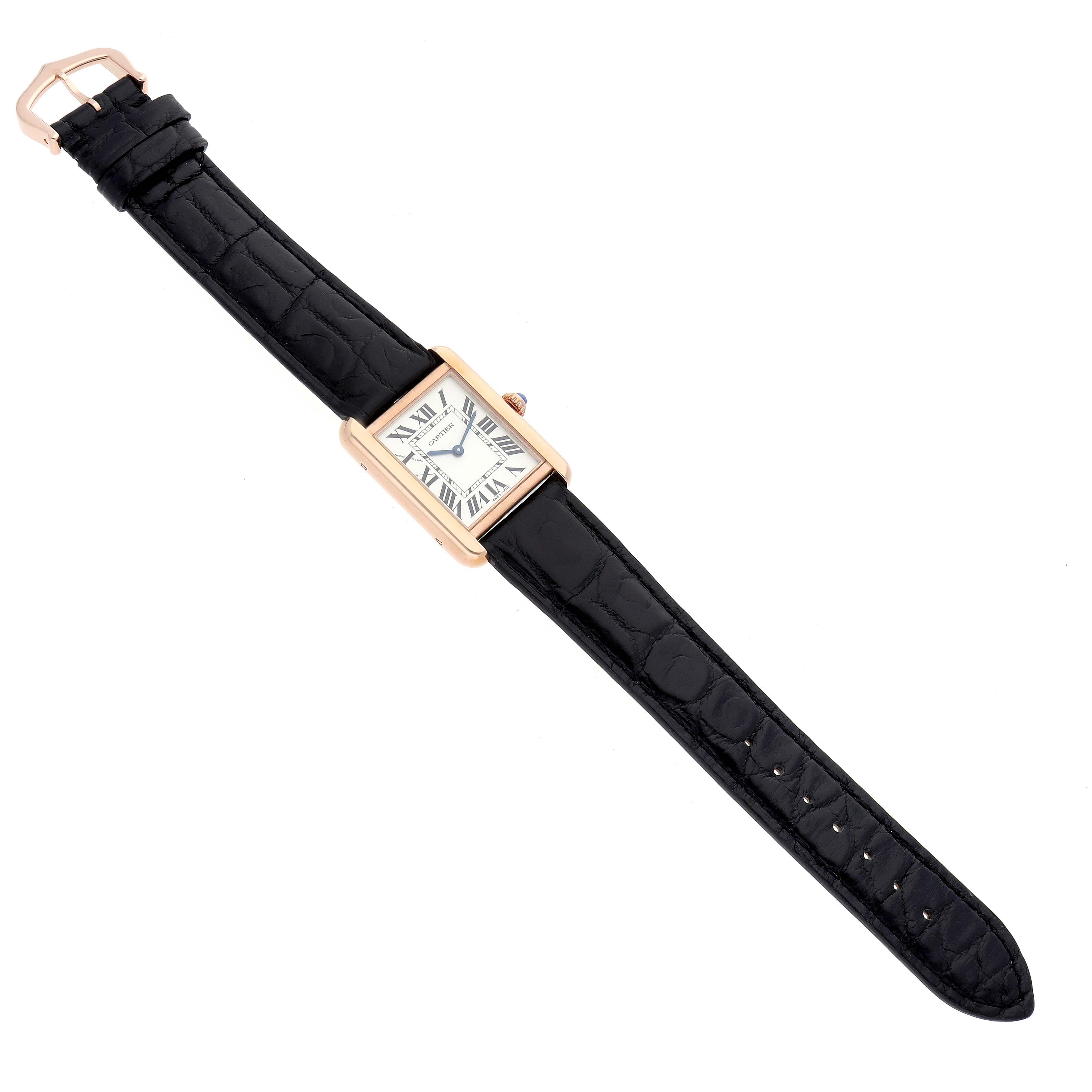 The Cartier Tank Solo W5200024 Women
s Rose Gold Silver Dial watch is shown from a top view, displaying the rectangular face, black leather strap, and rose gold case.