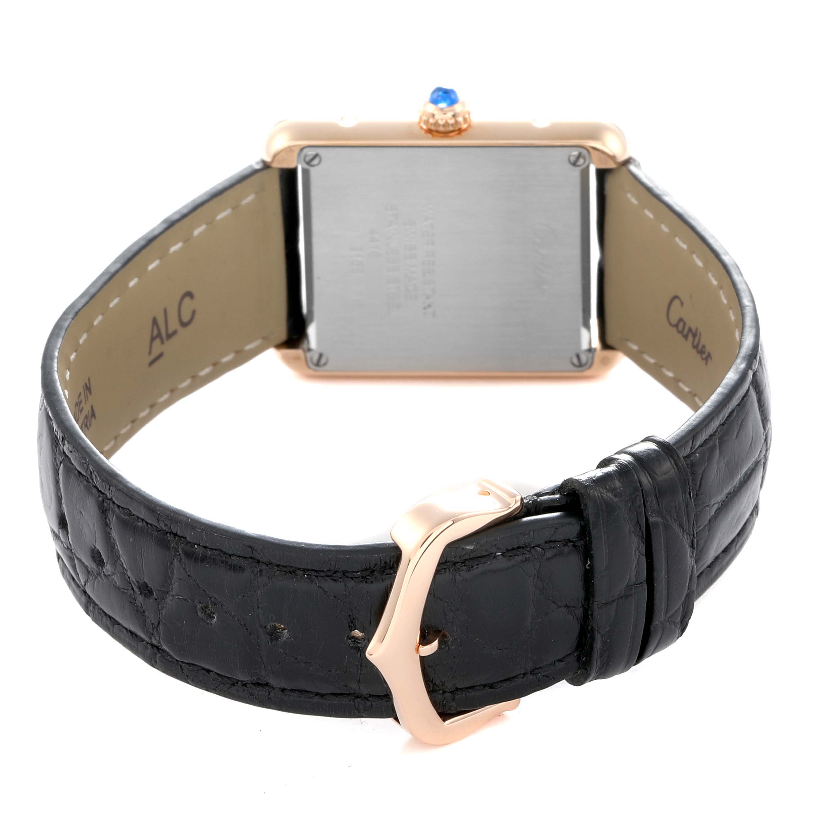 The image shows the back of a Cartier Tank Solo W5200024 Women
s Rose Gold Silver Dial watch, highlighting its leather strap, buckle, and case back.