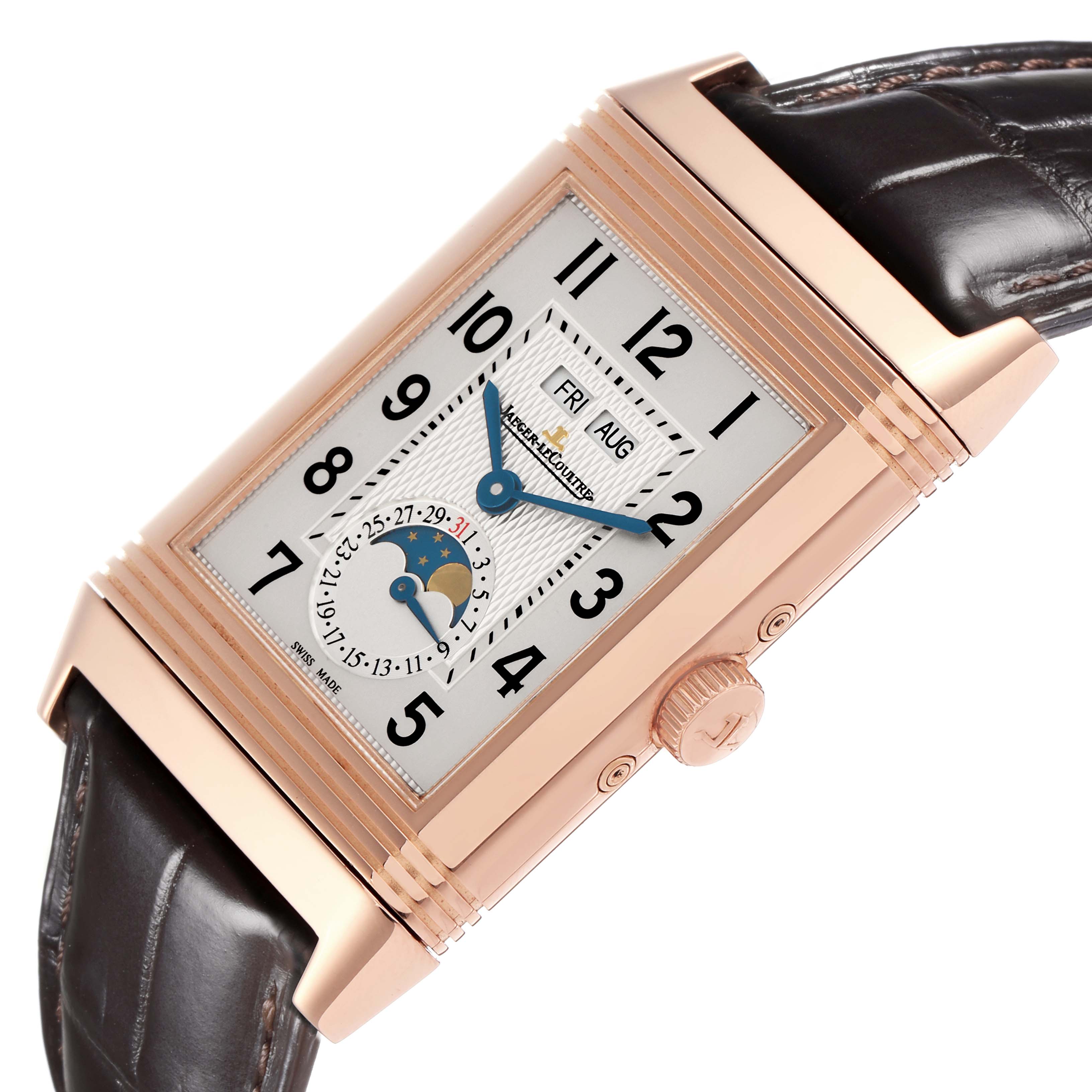 The Jaeger-LeCoultre Reverso watch is shown from a side angle, highlighting the crown, case, dial, and black leather strap.