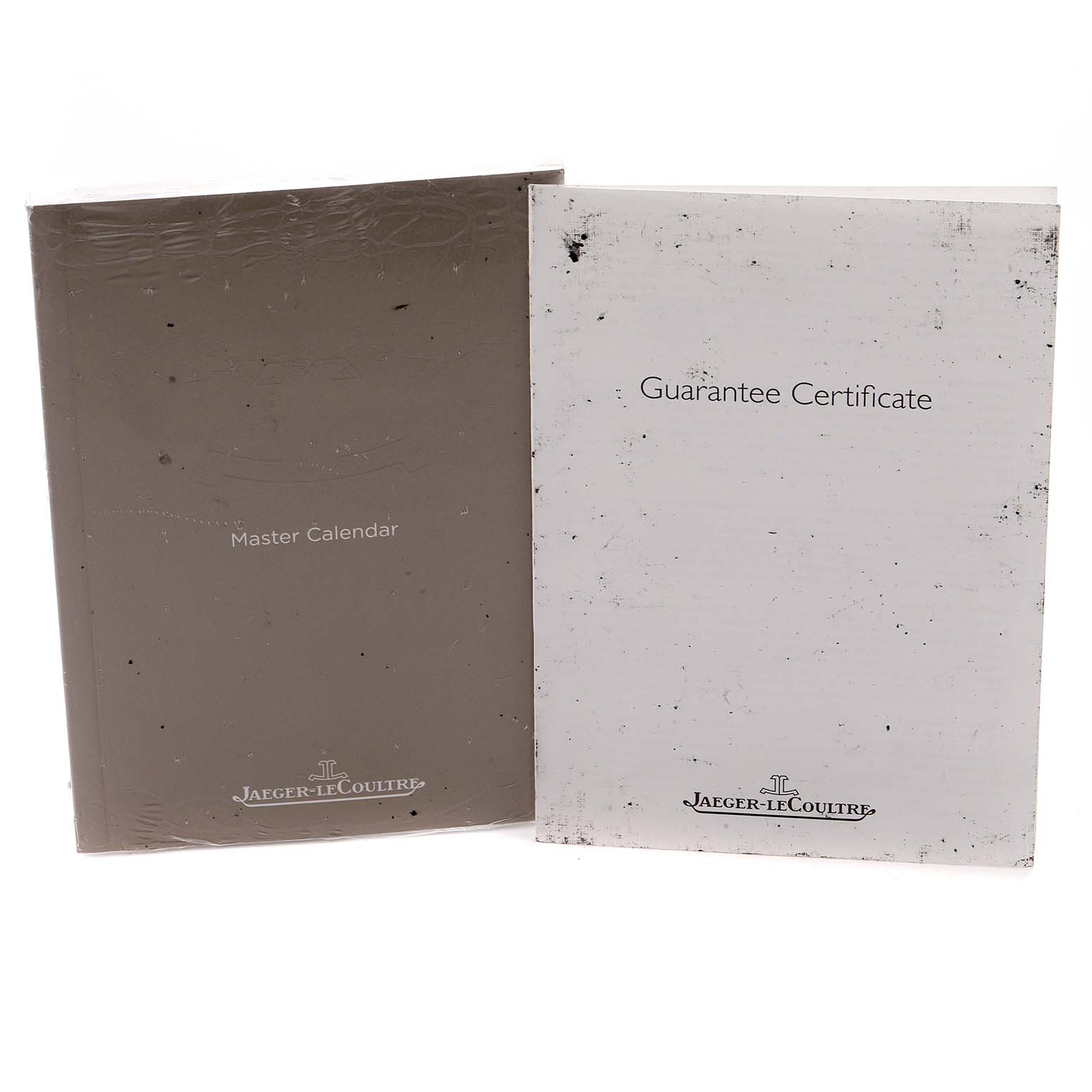 The image shows the Master model's documents from Jaeger-LeCoultre, including a "Master Calendar" booklet and a "Guarantee Certificate."