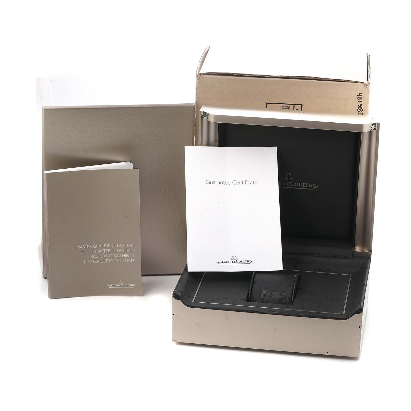 The image shows the packaging and accessories for the Jaeger LeCoultre Master 174.8.37.S Q1288430 Men's Stainless Steel Champagne Dial, including the box and guarantee certificate.