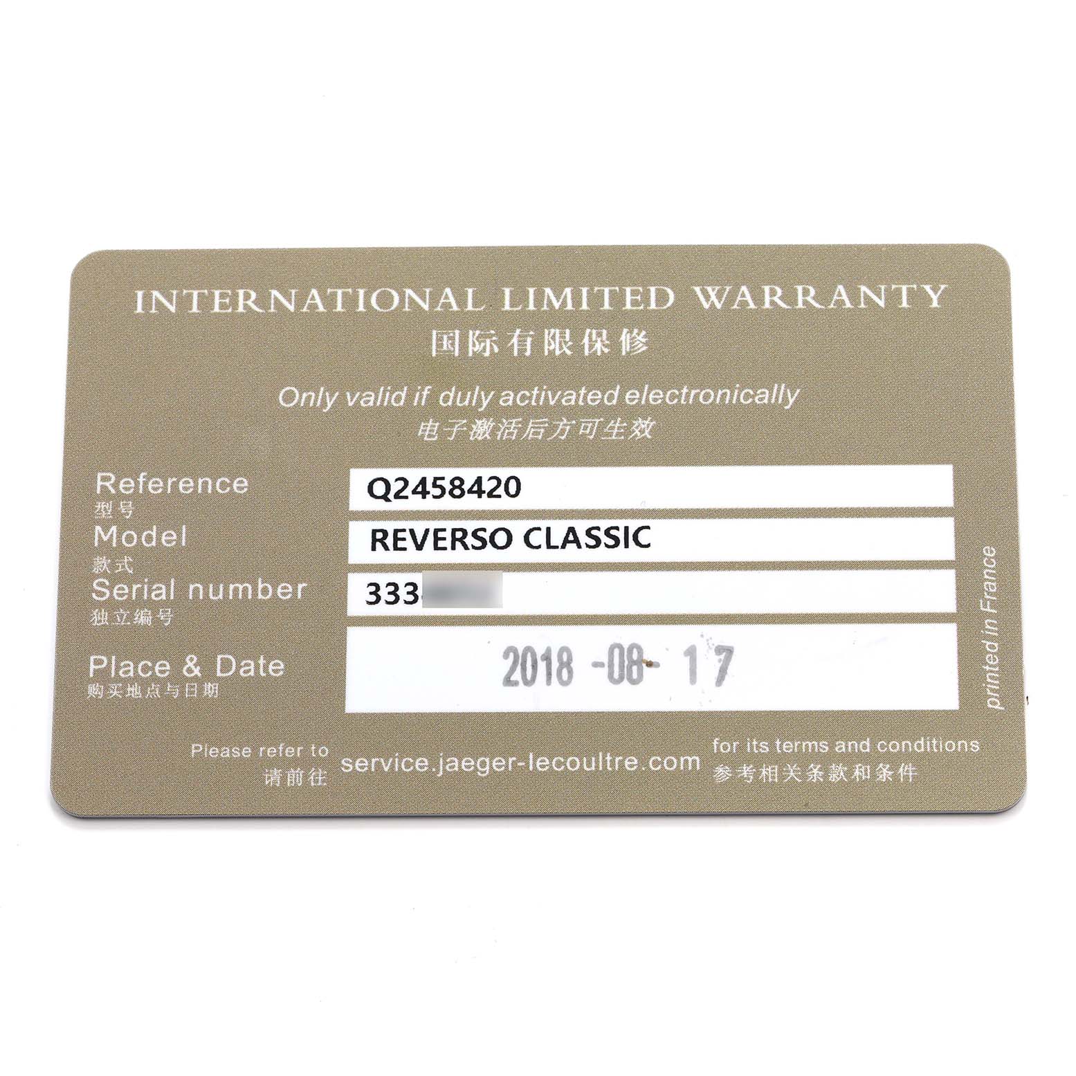 The image shows an International Limited Warranty card for the Jaeger LeCoultre Reverso Q2458420 Men's Stainless Steel Silver Dial Classic watch.