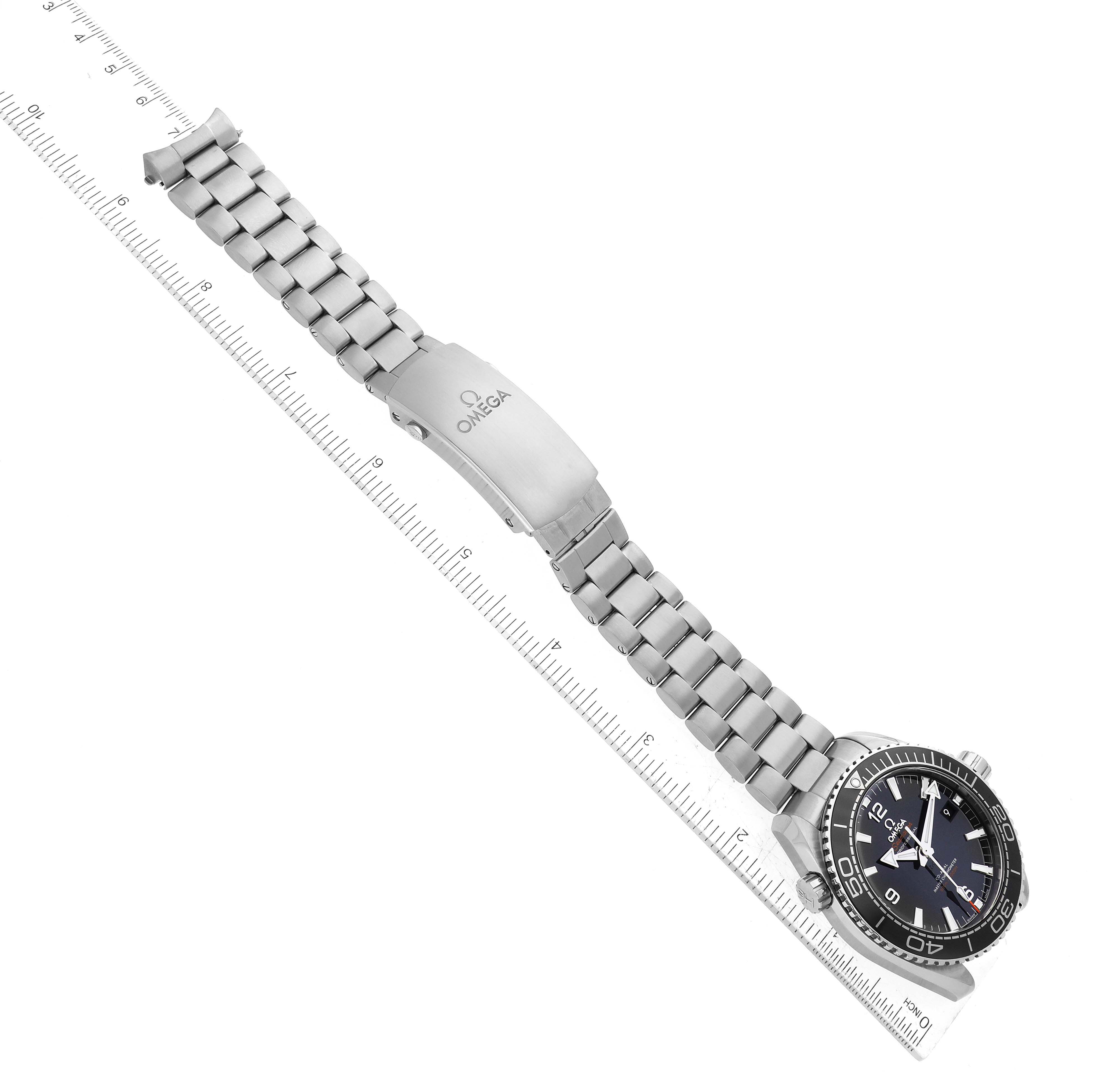 The image shows an Omega Planet Ocean 215.30.44.21.01.001 Men
s Stainless Steel Black Dial 215.30.44.21.01.001 Men
s Stainless Steel Black Dial model watch laid flat with its full bracelet and clasp visible alongside a ruler.