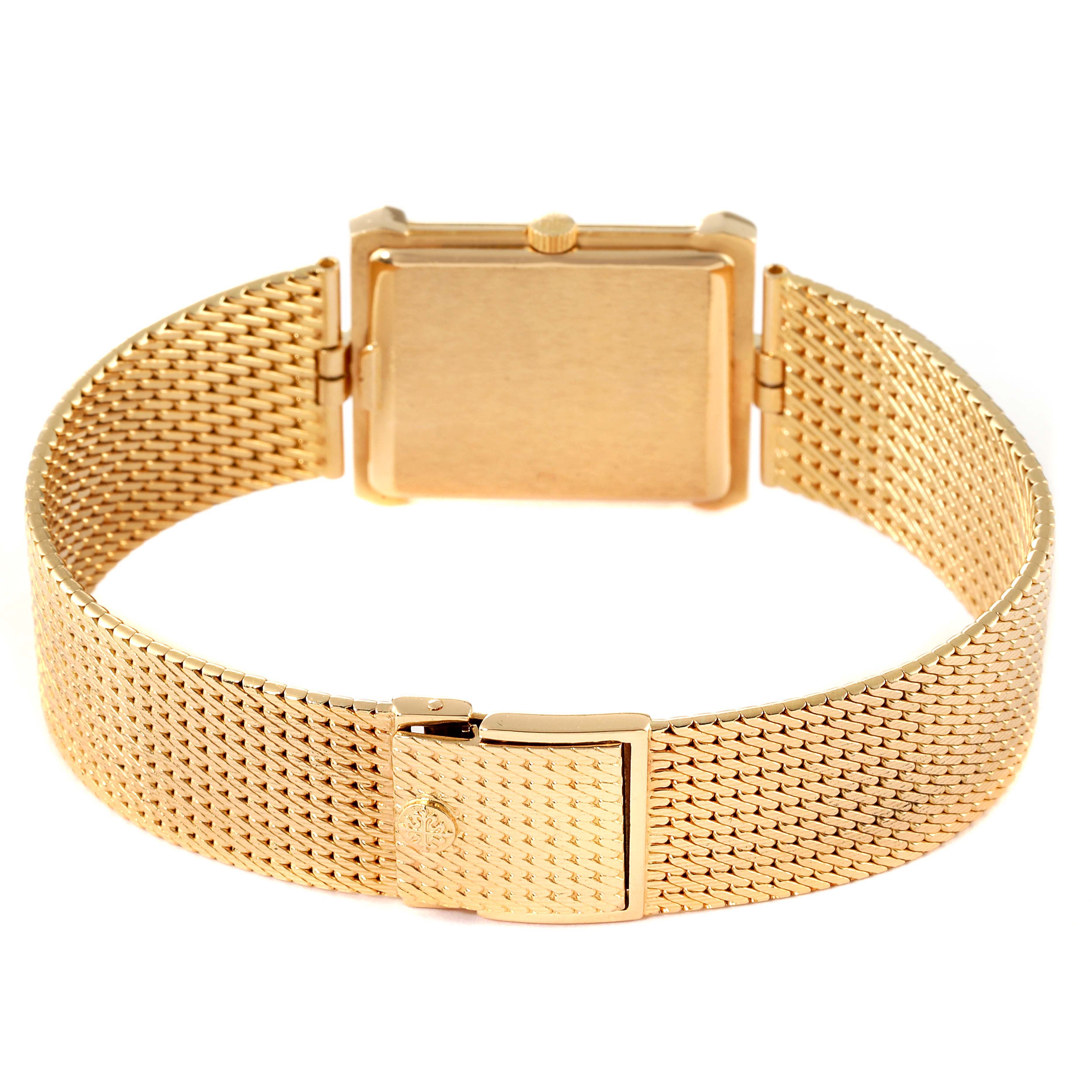 The image shows the back view of the Patek Philippe Gondolo 3776/2 Men's Yellow Gold Beige Dial 3776/2 Men's Yellow Gold Beige Dial watch, highlighting its gold mesh bracelet and clasp.