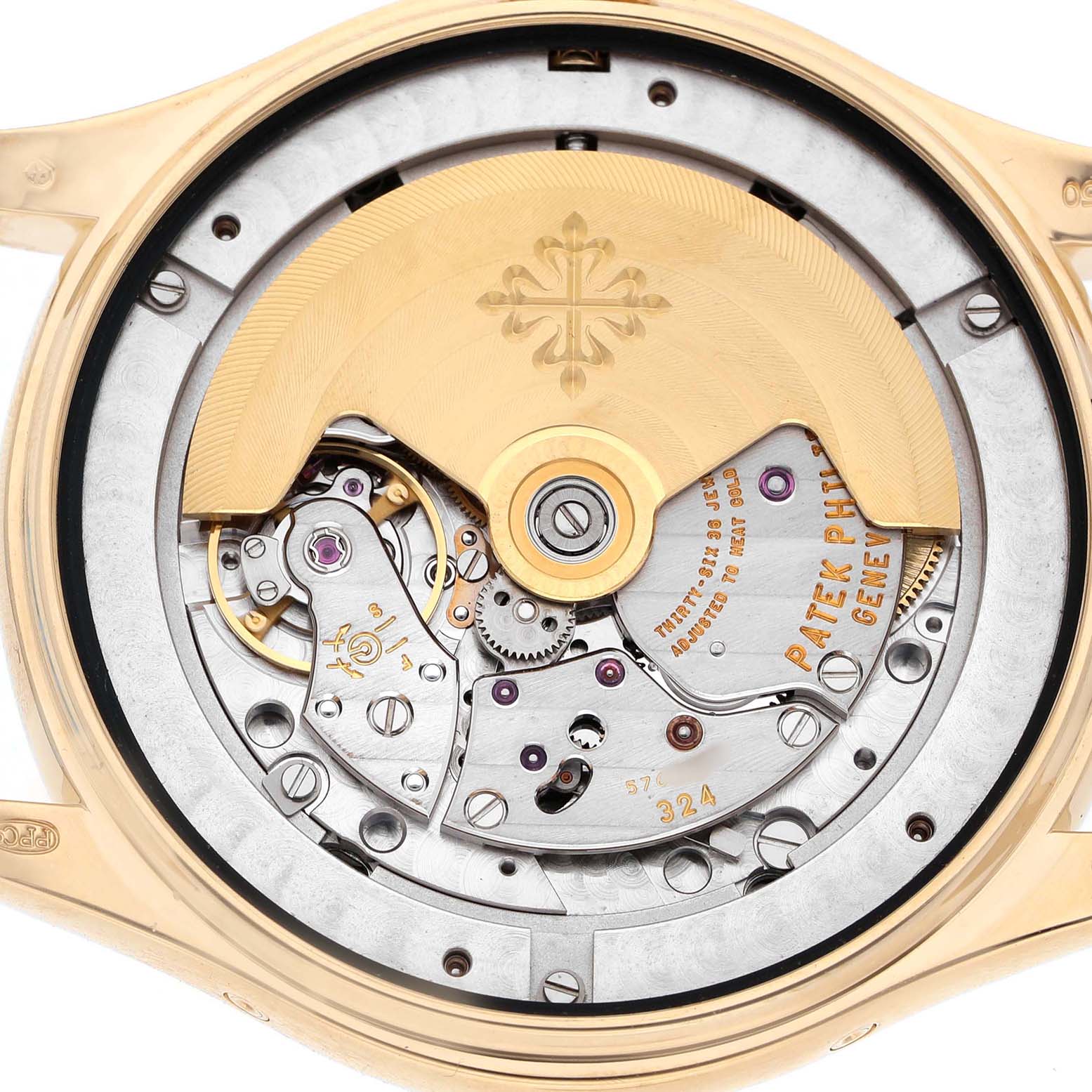The image shows the movement of a Patek Philippe Complications 5146J-001 Men's Yellow Gold Beige Dial model from a rear angle, highlighting the rotor and inner mechanics.