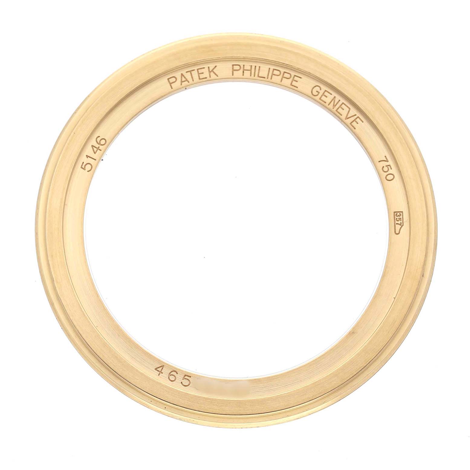 The image shows the gold bezel of a Patek Philippe Complications 5146J-001 Men's Yellow Gold Beige Dial model, viewed from above.