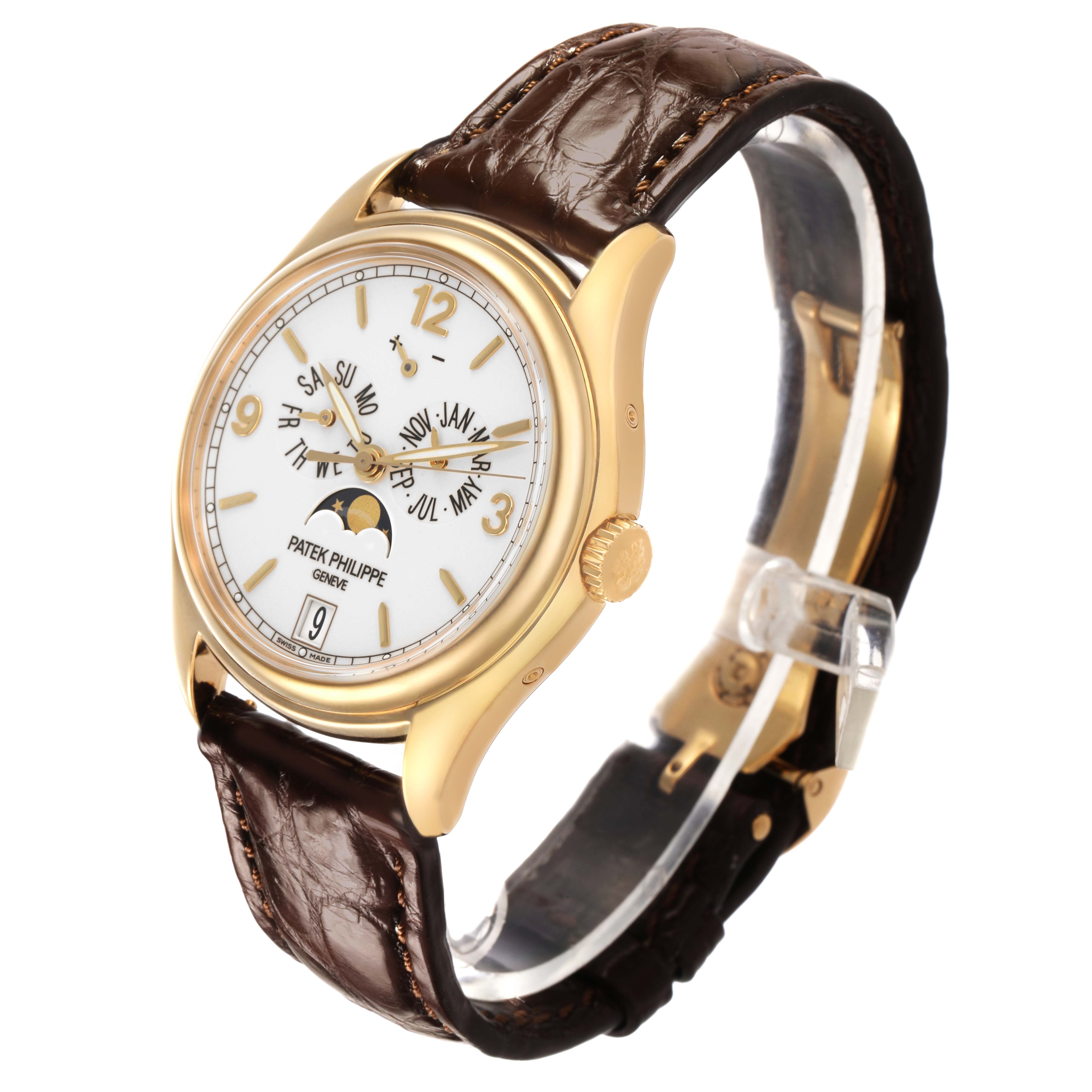 The Patek Philippe Complications 5146J-001 Men's Yellow Gold Beige Dial watch is shown at a three-quarter angle, highlighting the face, side crown, and leather strap.