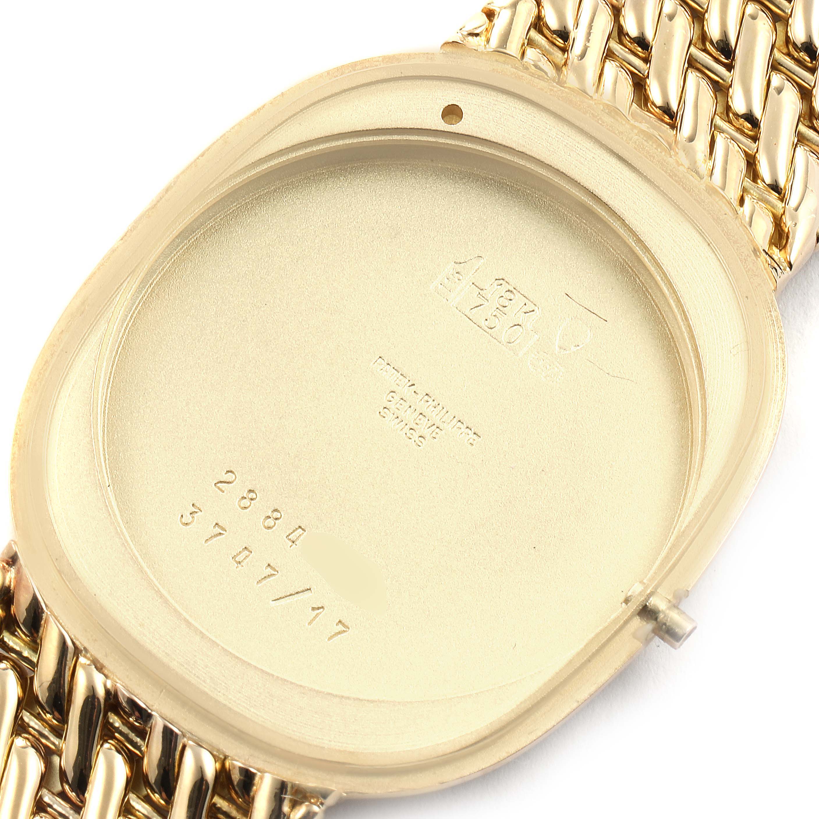 The image shows the inner case back of a Patek Philippe Golden Ellipse 3747/17 Men's Yellow Gold Beige Dial 3747/17 Men's Yellow Gold Beige Dial watch, displaying its engravings and serial numbers.