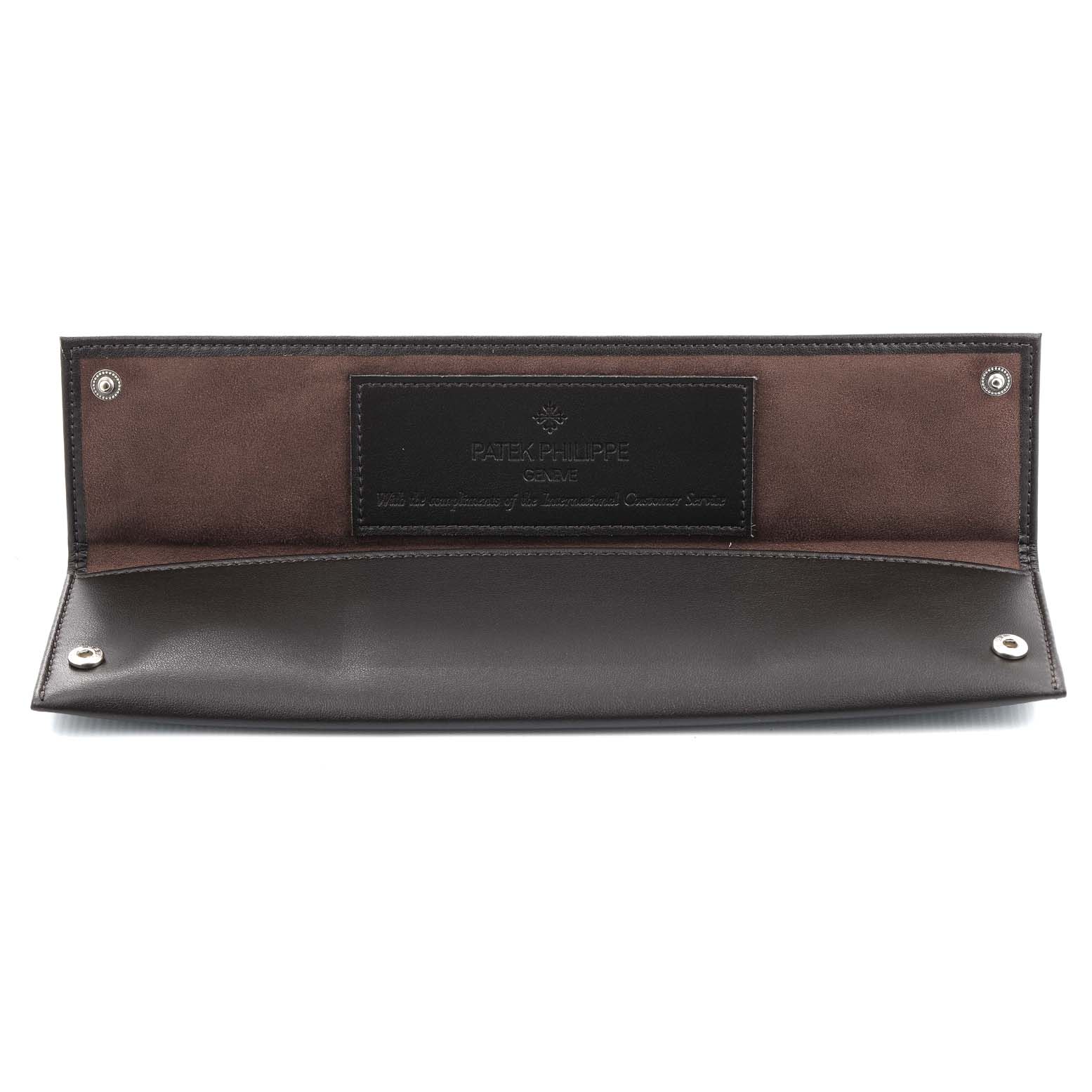 This image shows a leather case for the Patek Philippe Golden Ellipse 3747/17 Men's Yellow Gold Beige Dial 3747/17 Men's Yellow Gold Beige Dial watch, opened flat with snap closures visible.